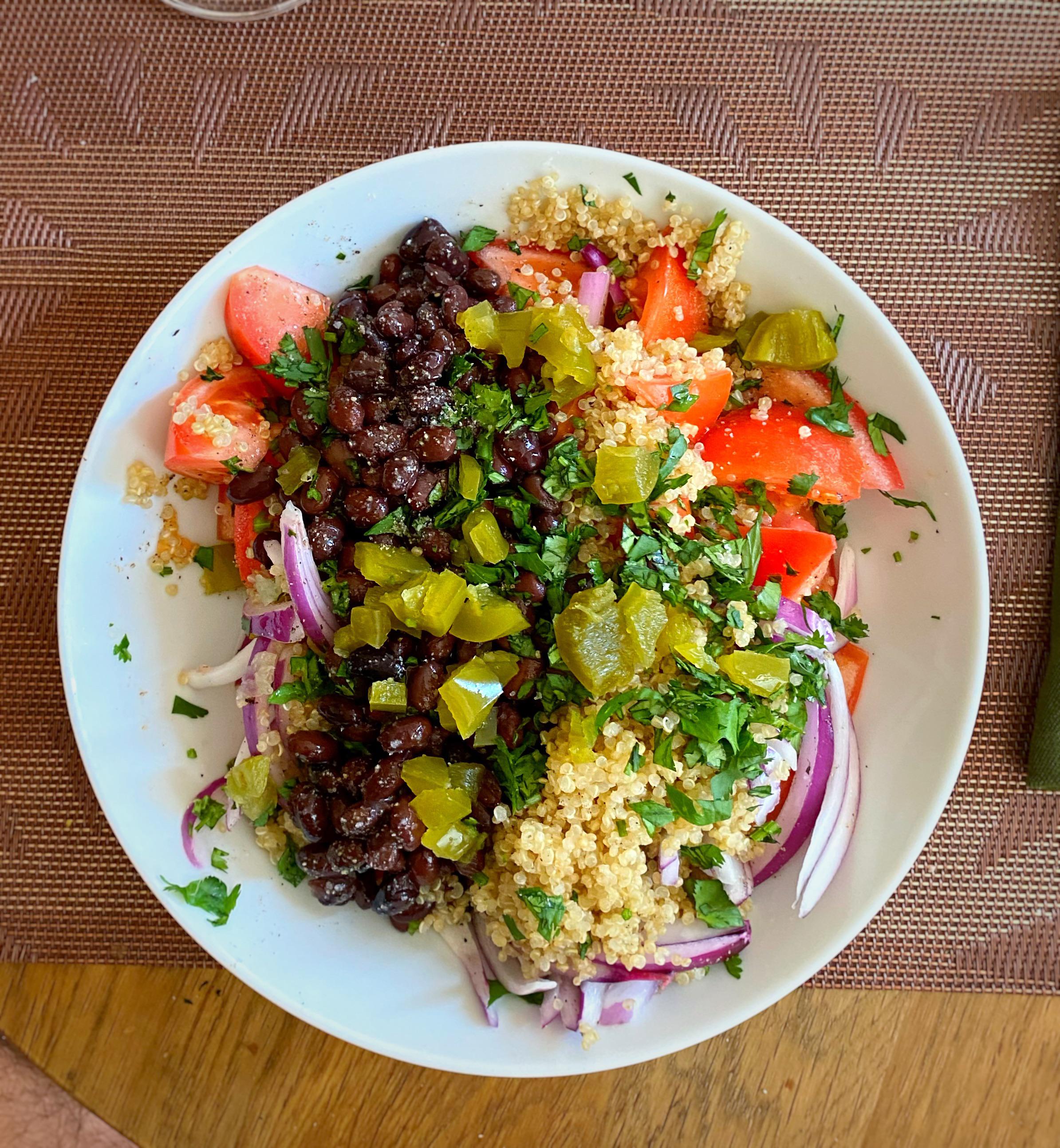 Quinoa, black beans, red onion, tomato, cilantro, jalapeño and lemon