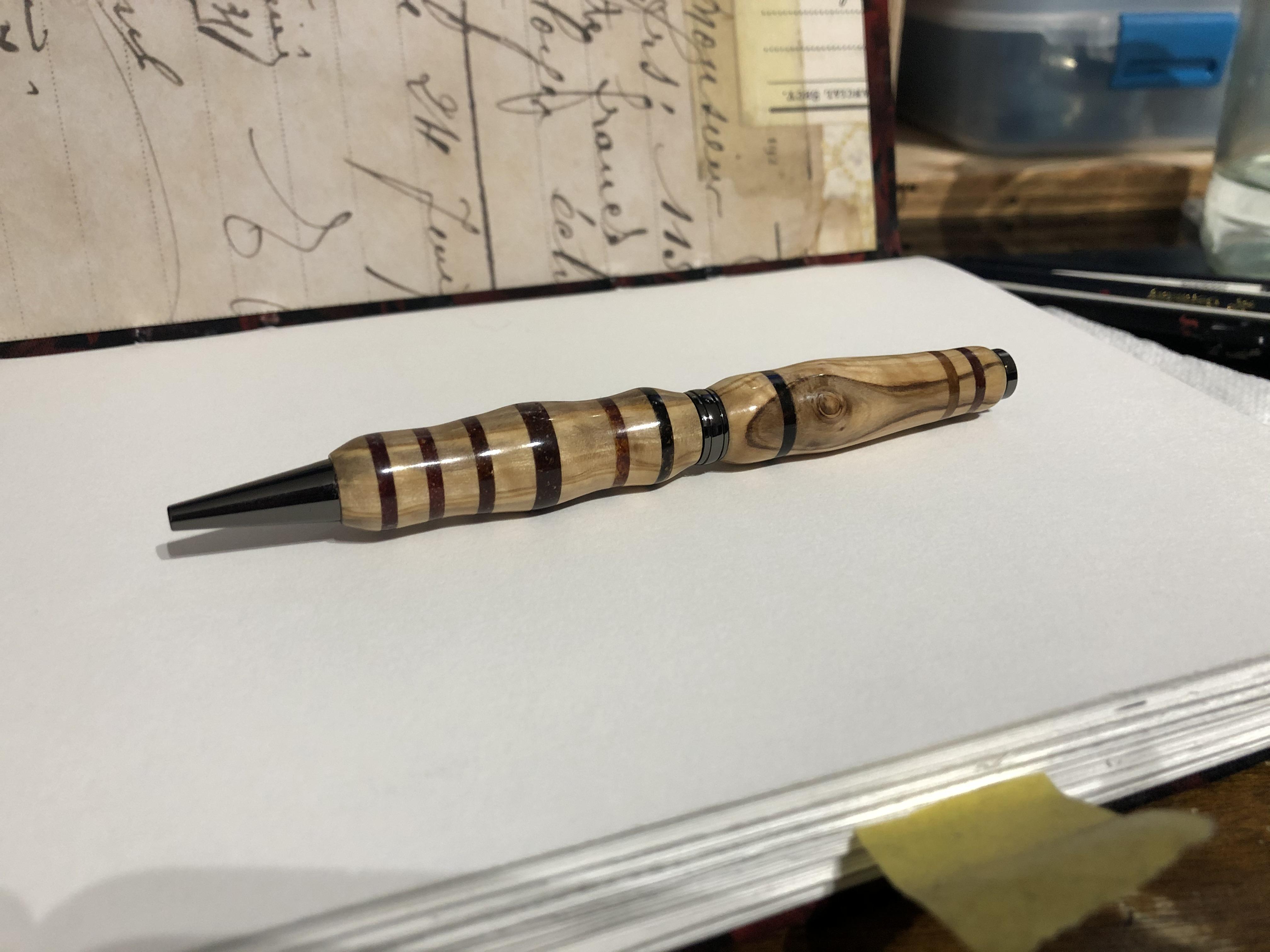 Pen I finished up today, olive wood with wood inlays. r/PenTurning