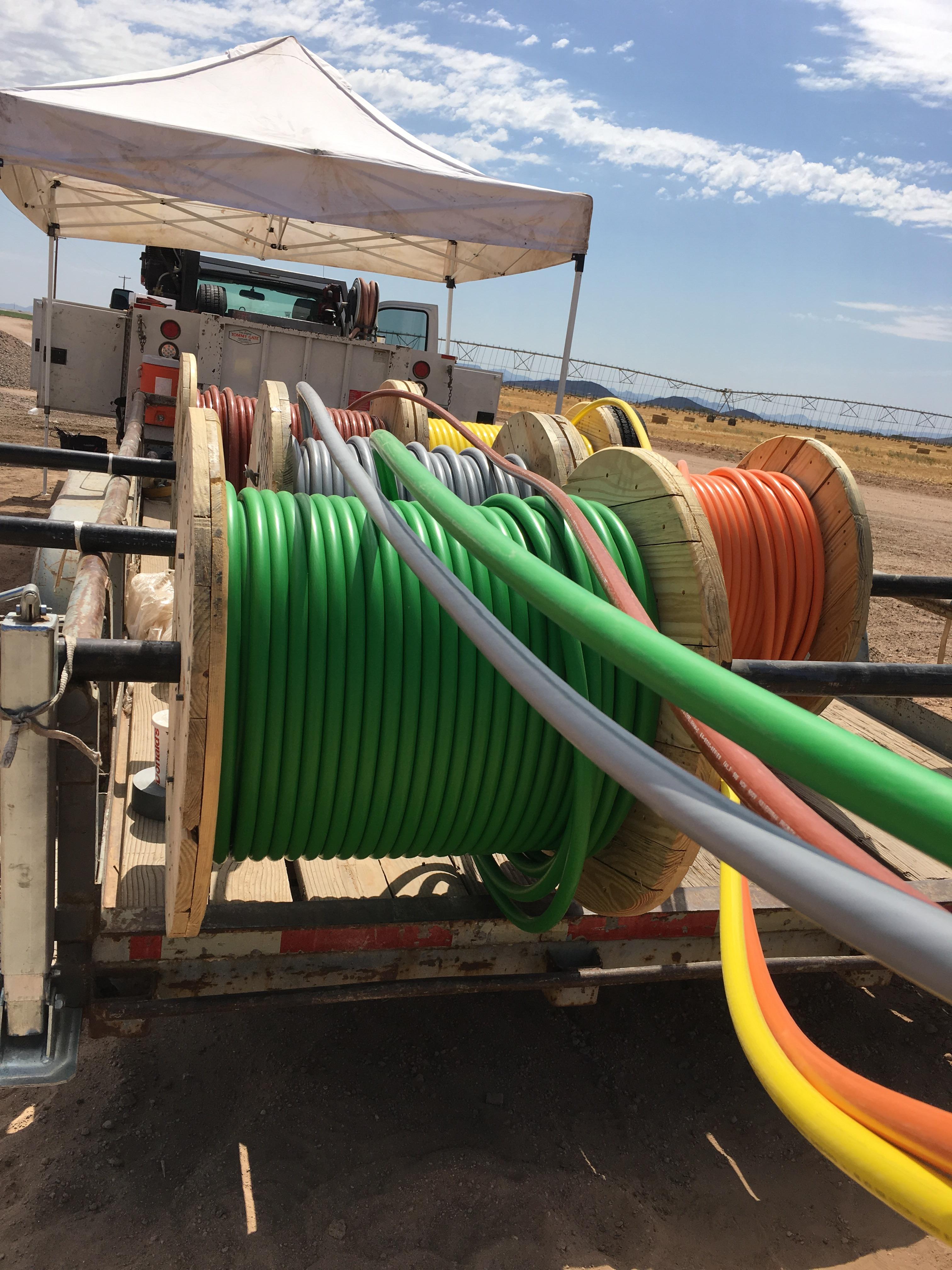 First time pulling cable from reels. Very fun day in the Arizona summer