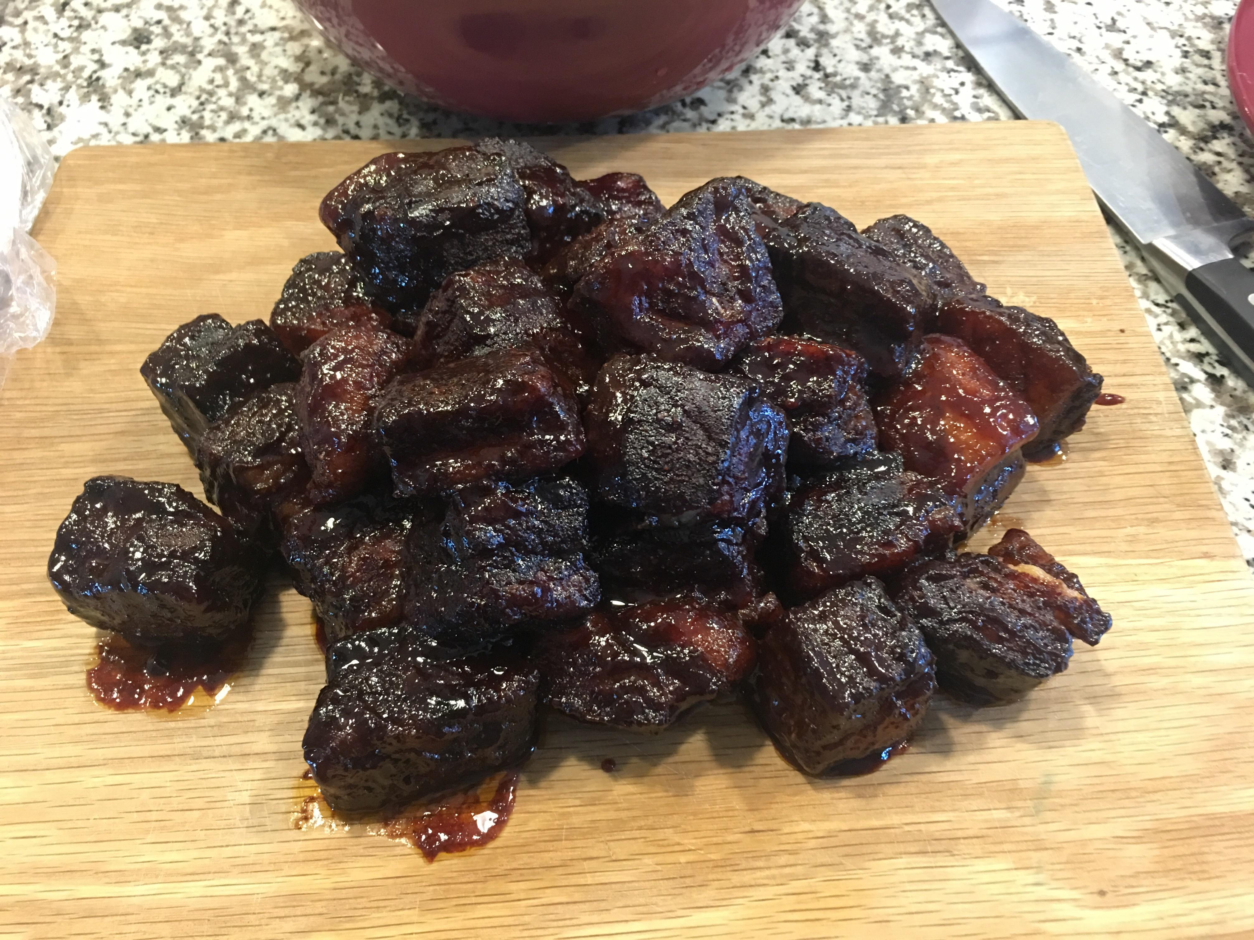 Finished pork belly burnt ends with black berry chipotle bbq sauce