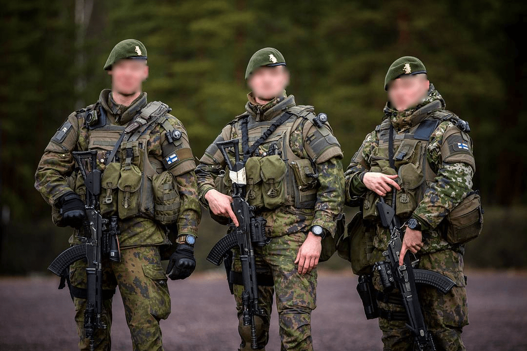 3 Finnish Rapid Deployment Force soldiers wearing their international