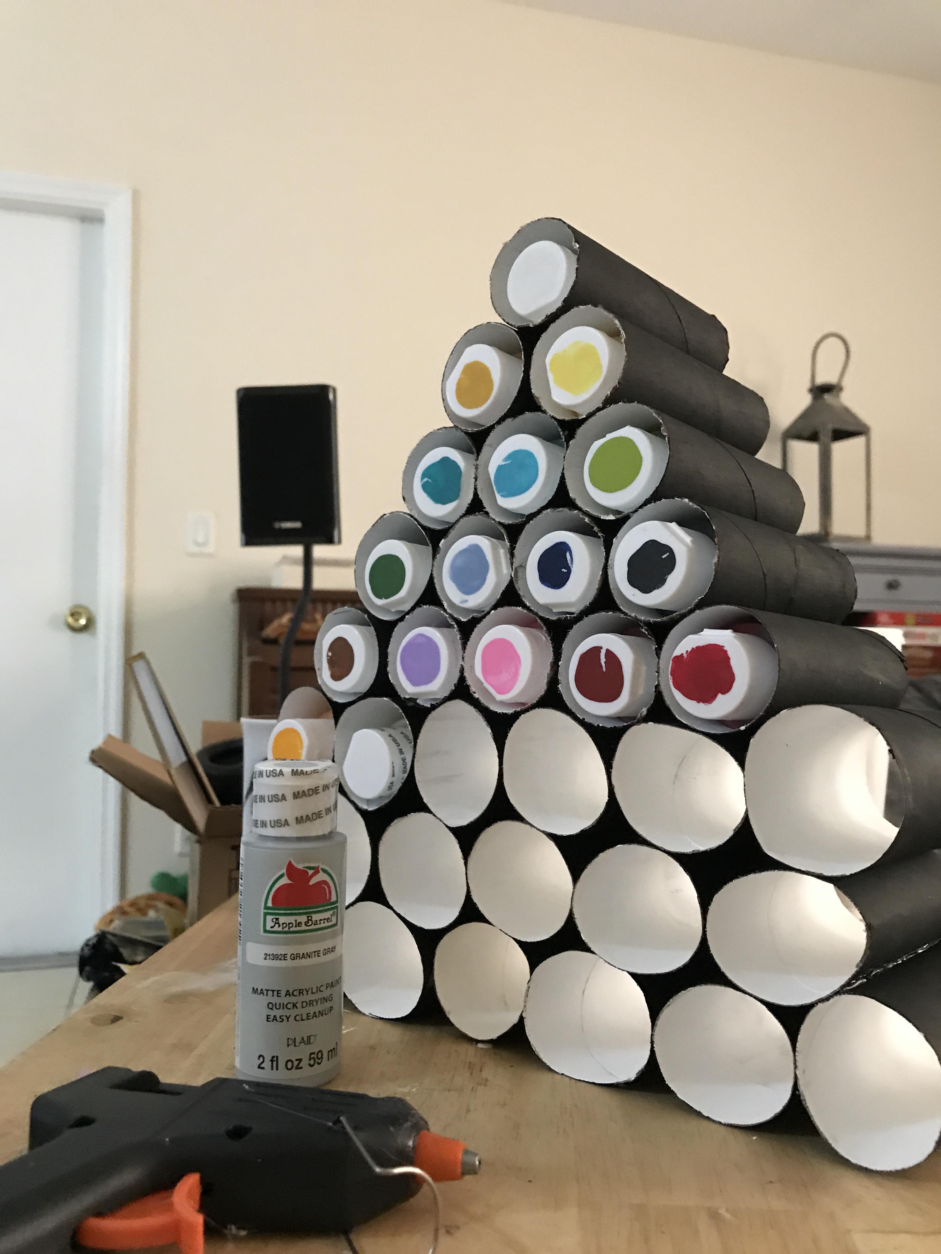 Empty tubes from gift wrapping paper? I used cheap paint, hot glue, and