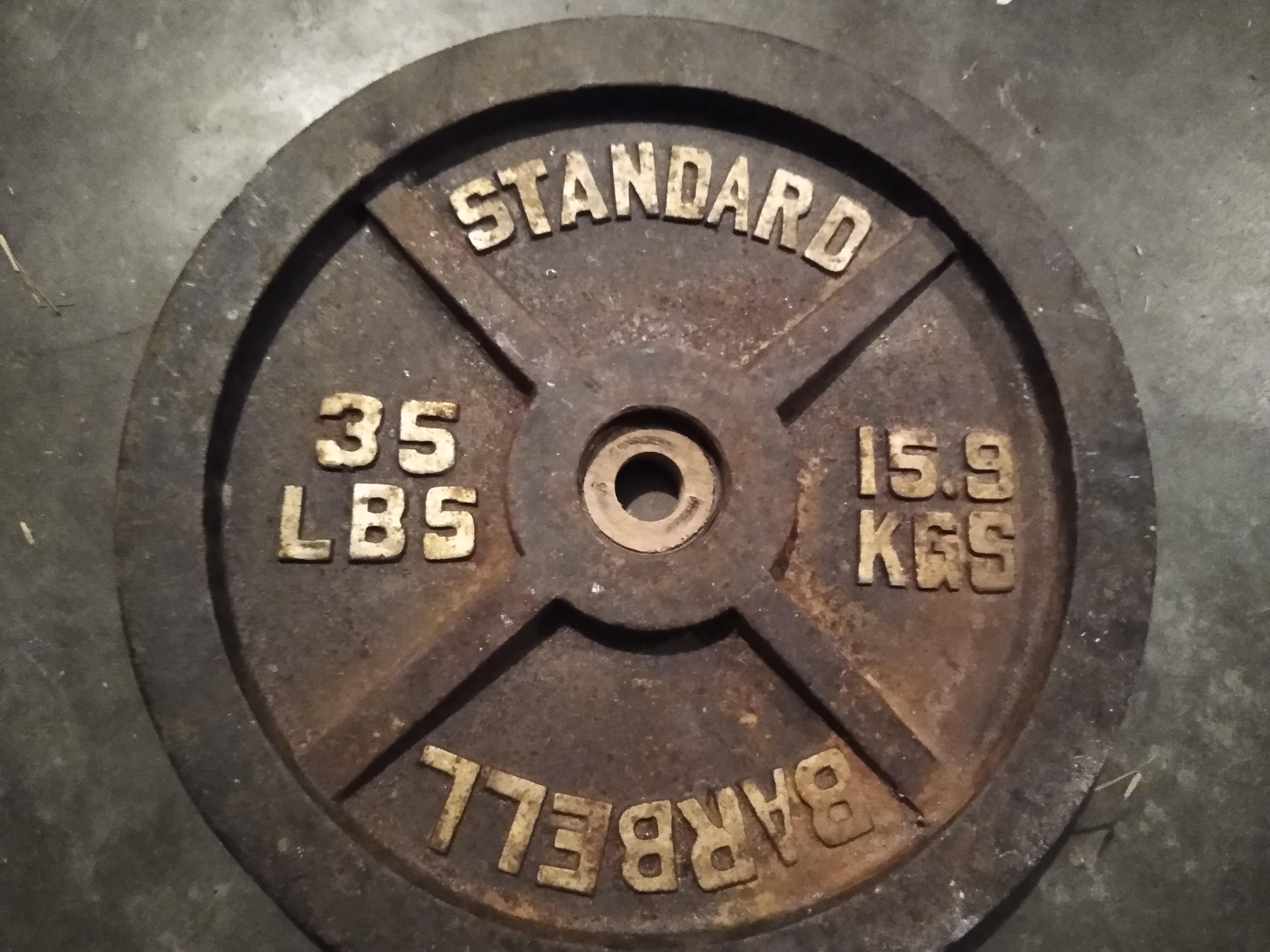 Found curbside Olympic weights. Built wooden adapter for my standard