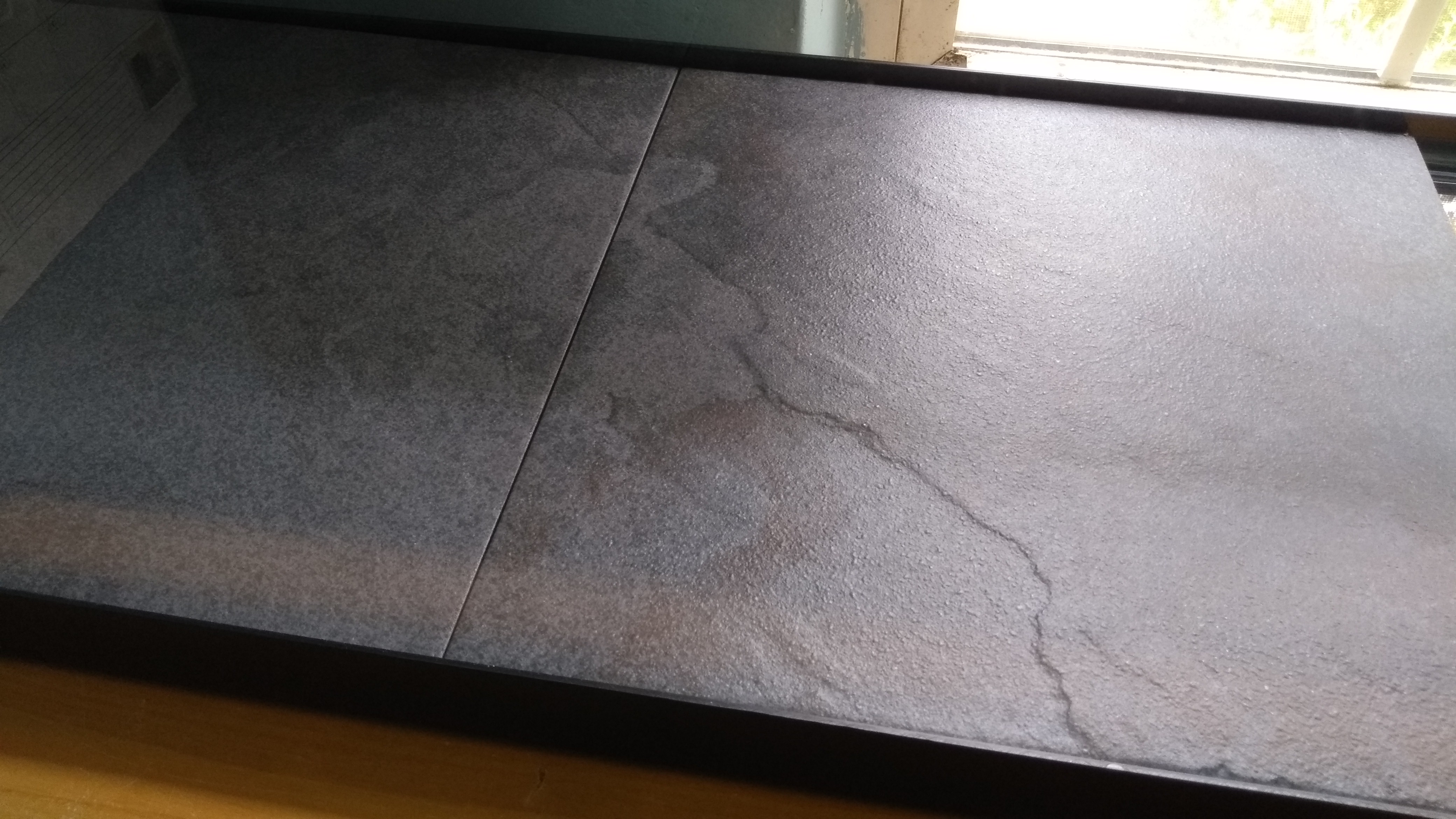 I was setting up my leopard gecko's tank and noticed that these 2 tiles