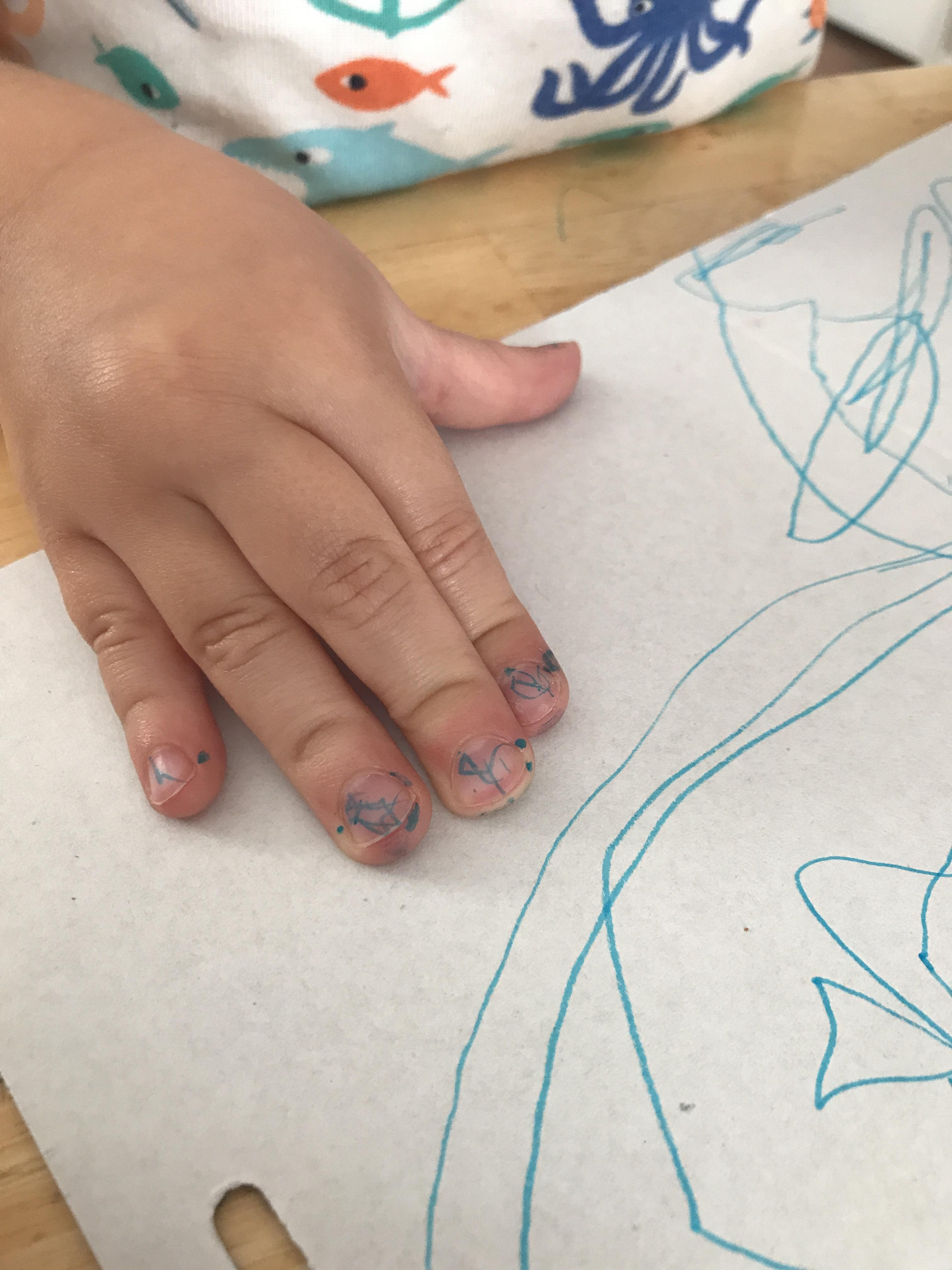 My son was colouring and decided to colour his nails, followed by