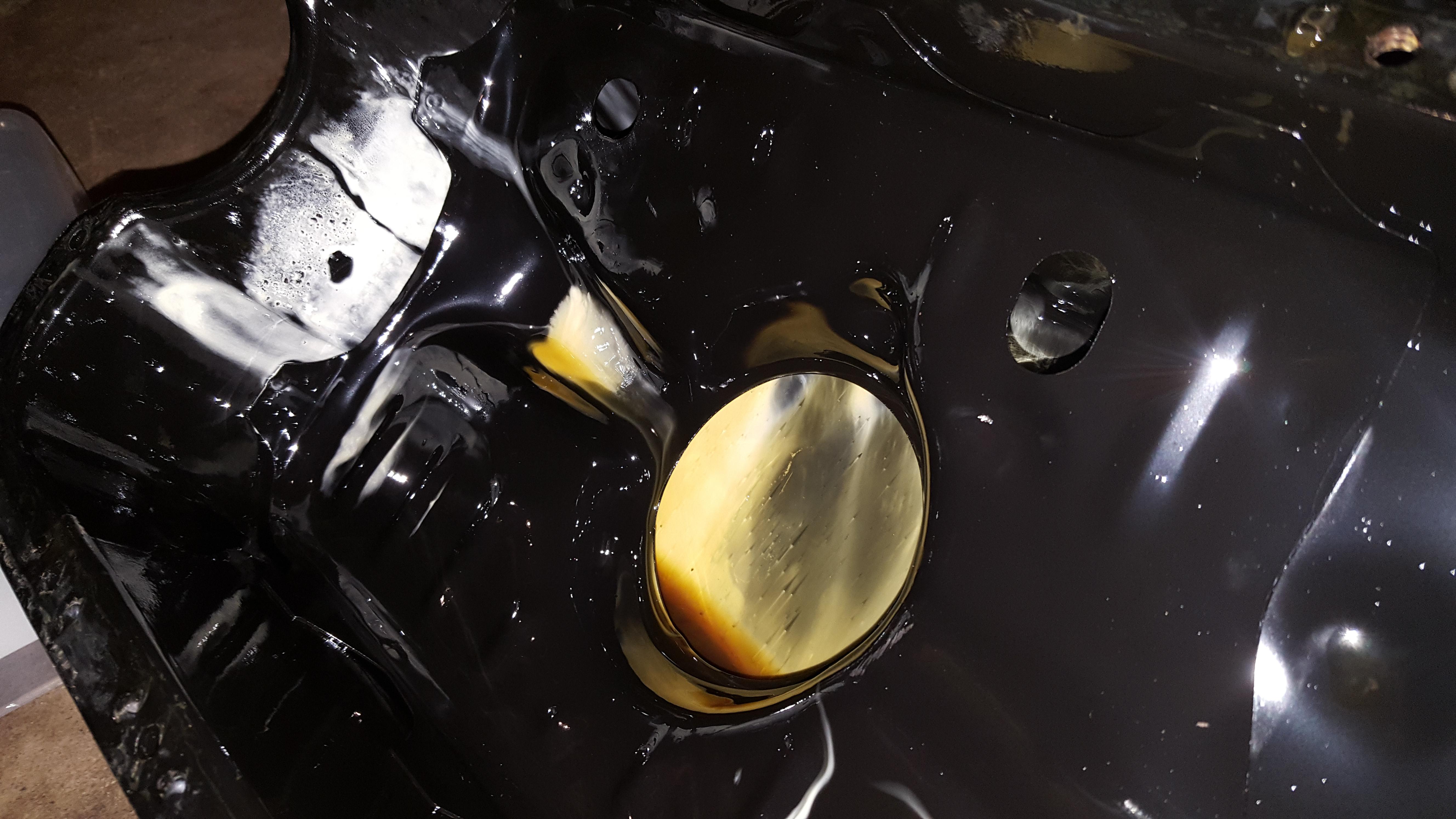 White gunk in oil pan, oil drains clean. Doesn't seem to be leaving the