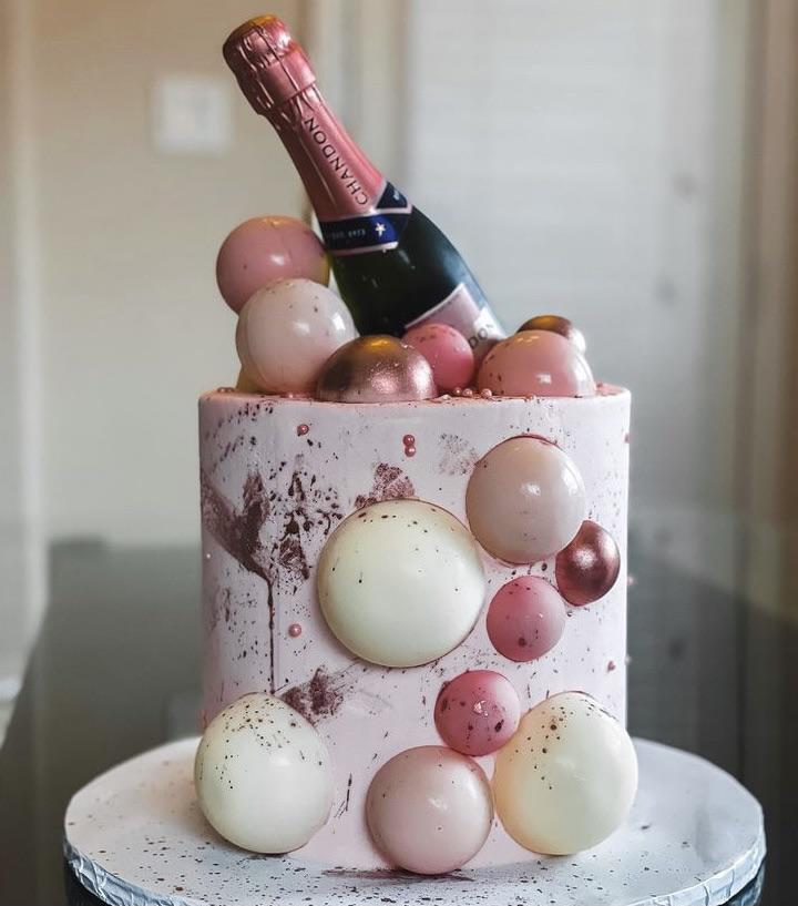 Chocolate Spheres inspired cake with a bottle of Chandon on top. This