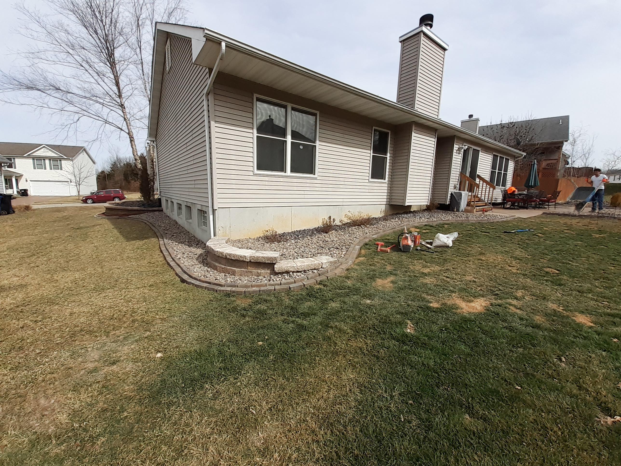 Small wall with edging and blue trap rock. r/landscaping