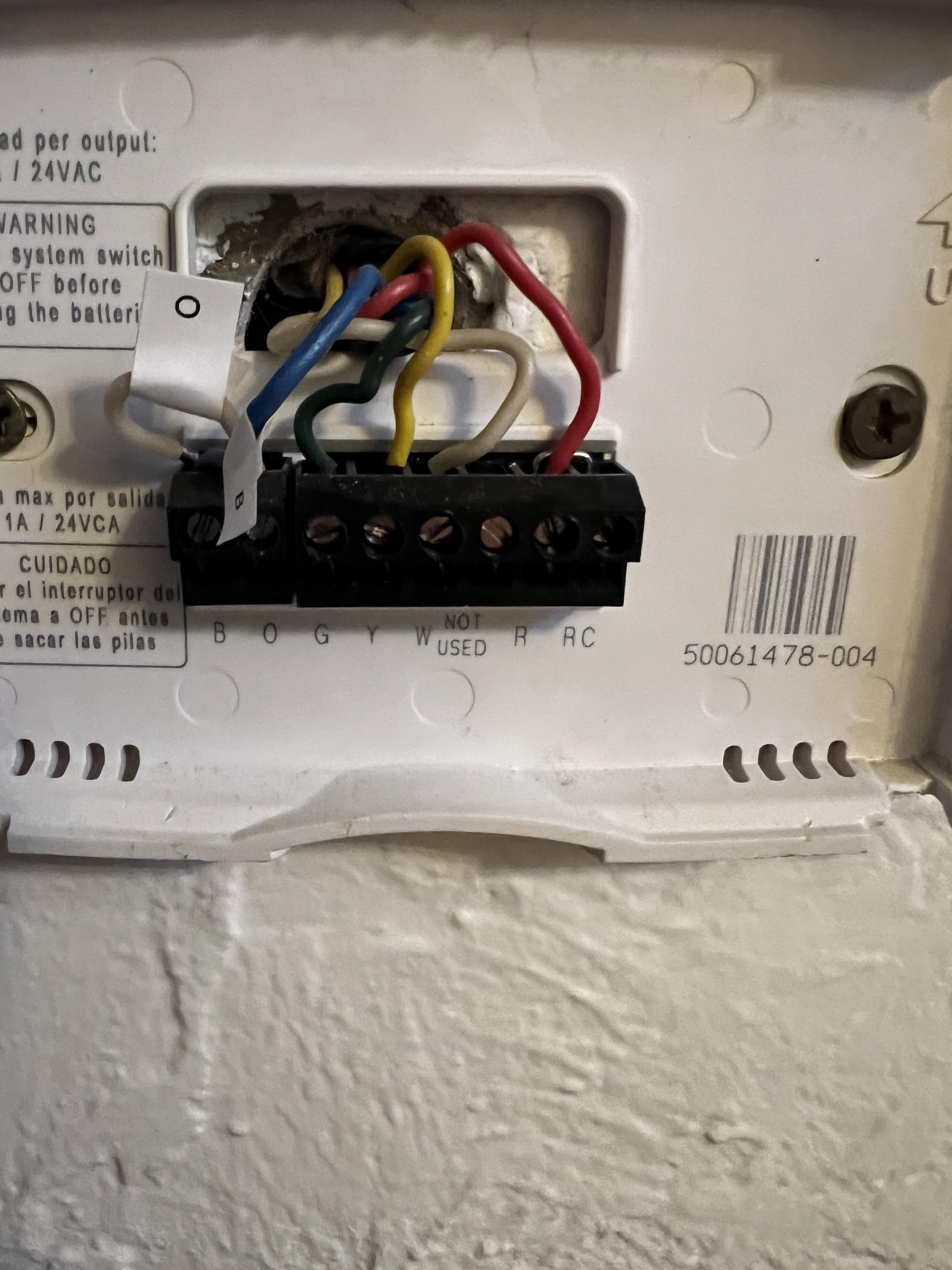 From the picture of the old thermostat I can't tell. I hooked up the