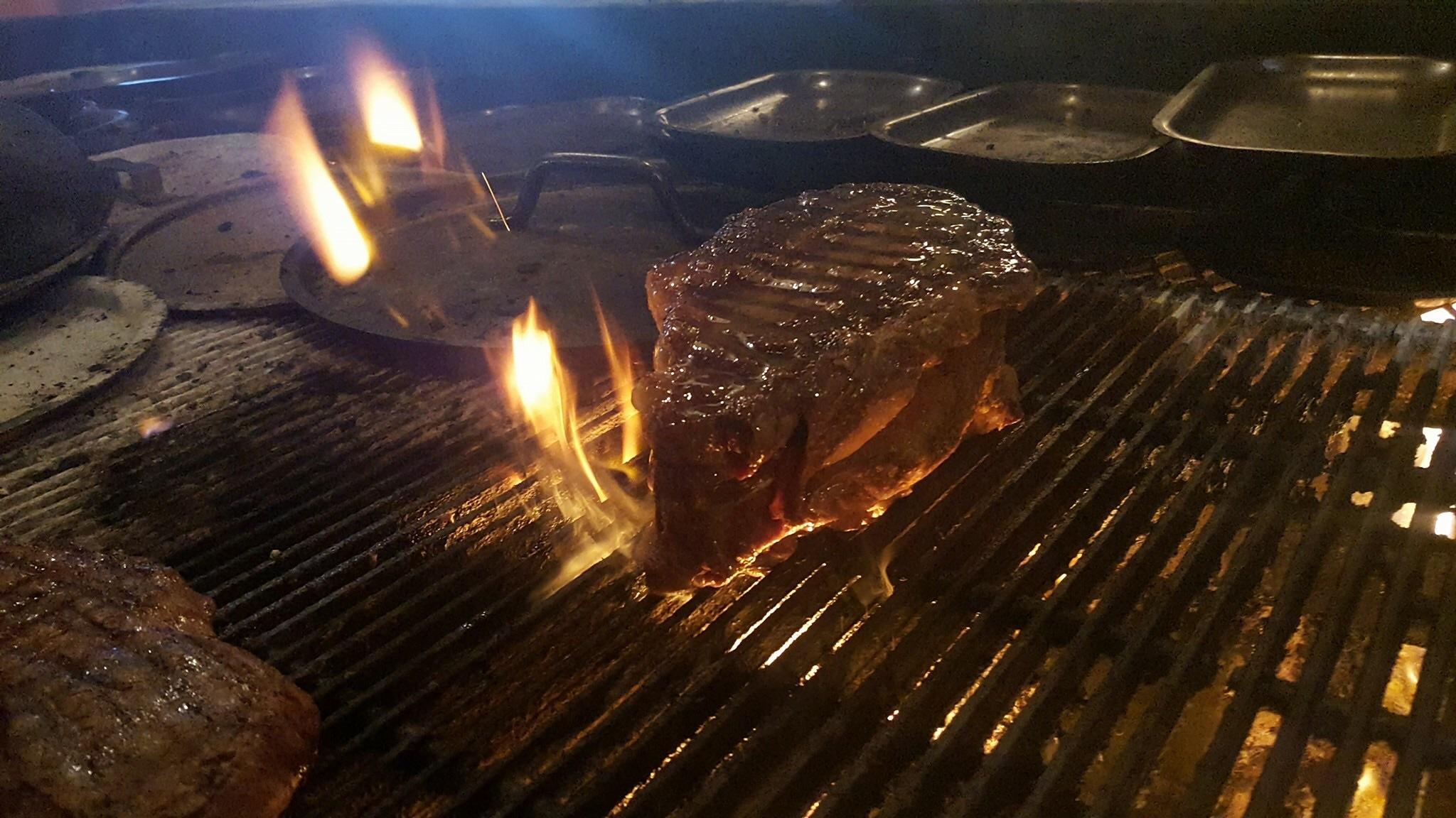 A 60oz Rib Eye steak being prepared by our favourite local steak house