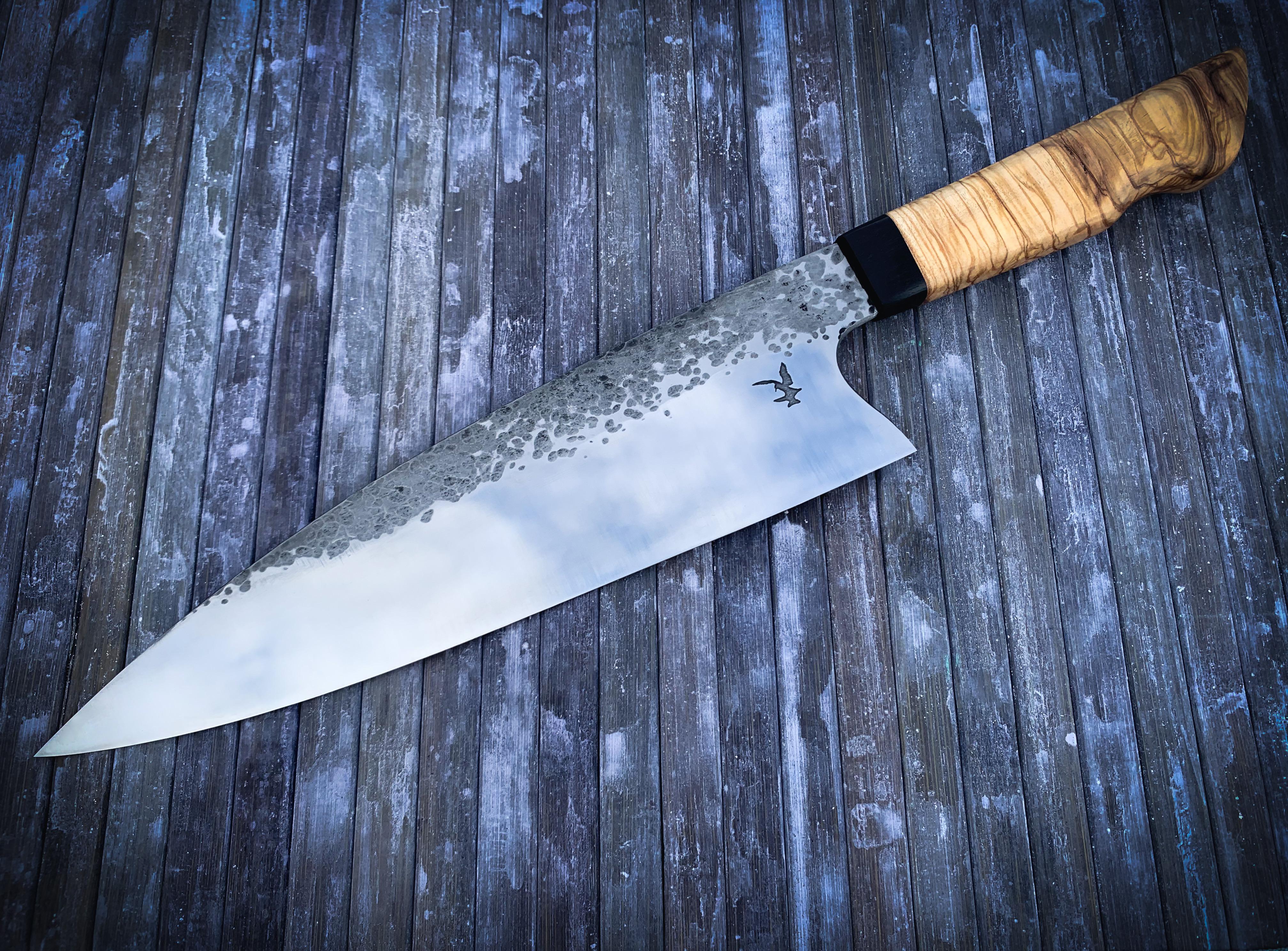 This comically large knife I made myself, specs in post r/chefknives