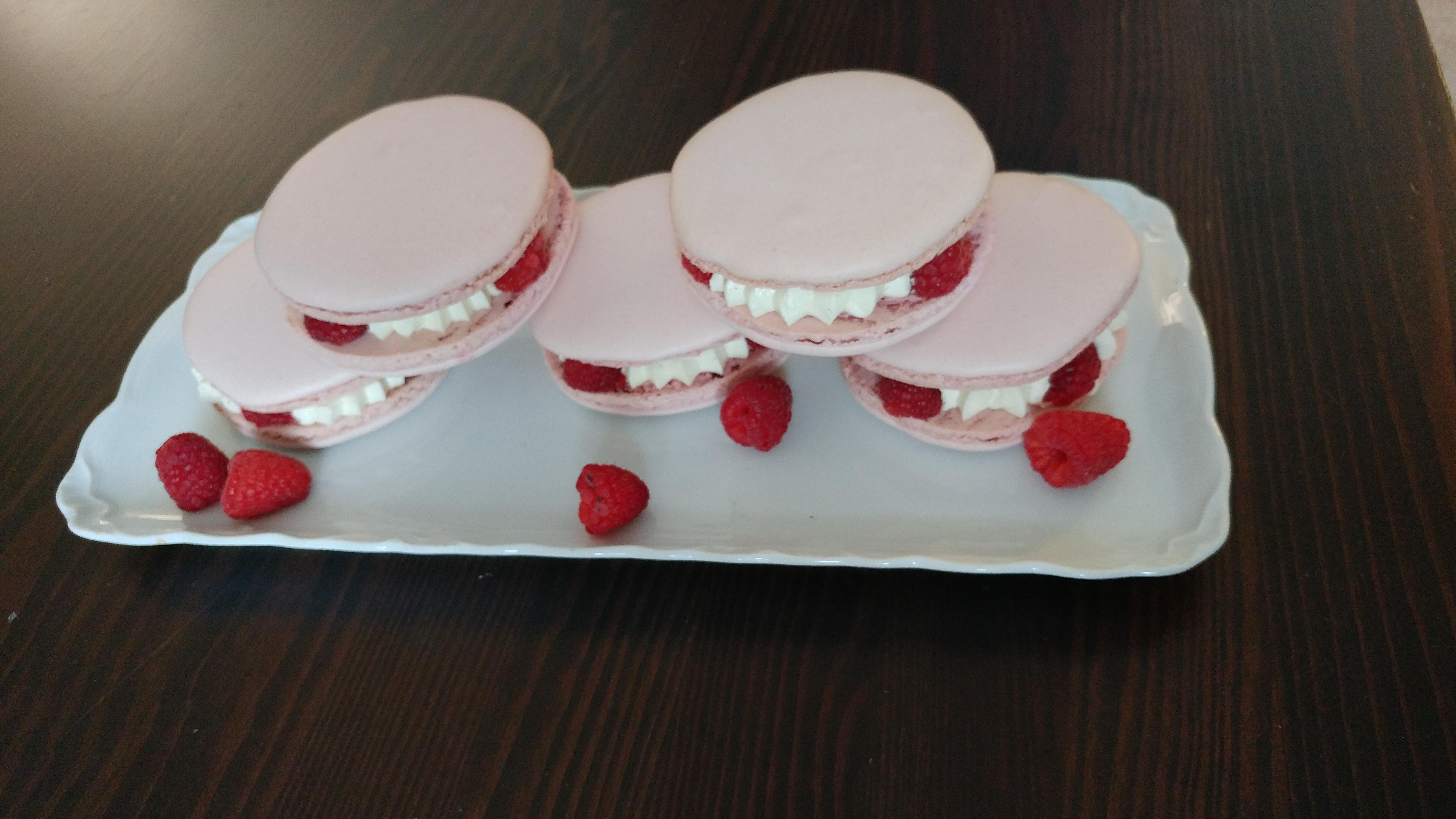 Jumbo macarons filled with vanilla bean IMBC and fresh raspberries. r