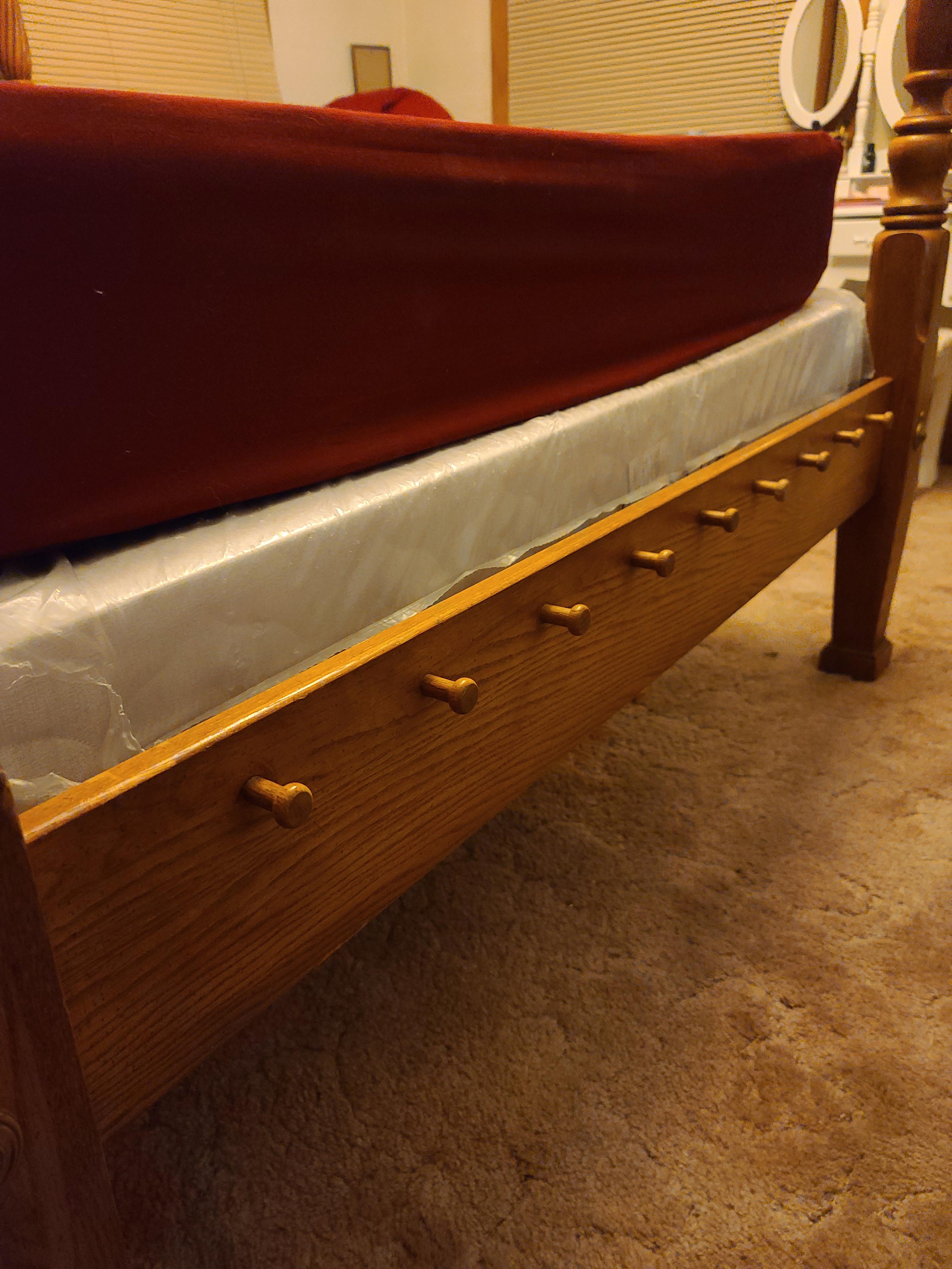 What are these pegs at the end of my bed used for? We thought they were