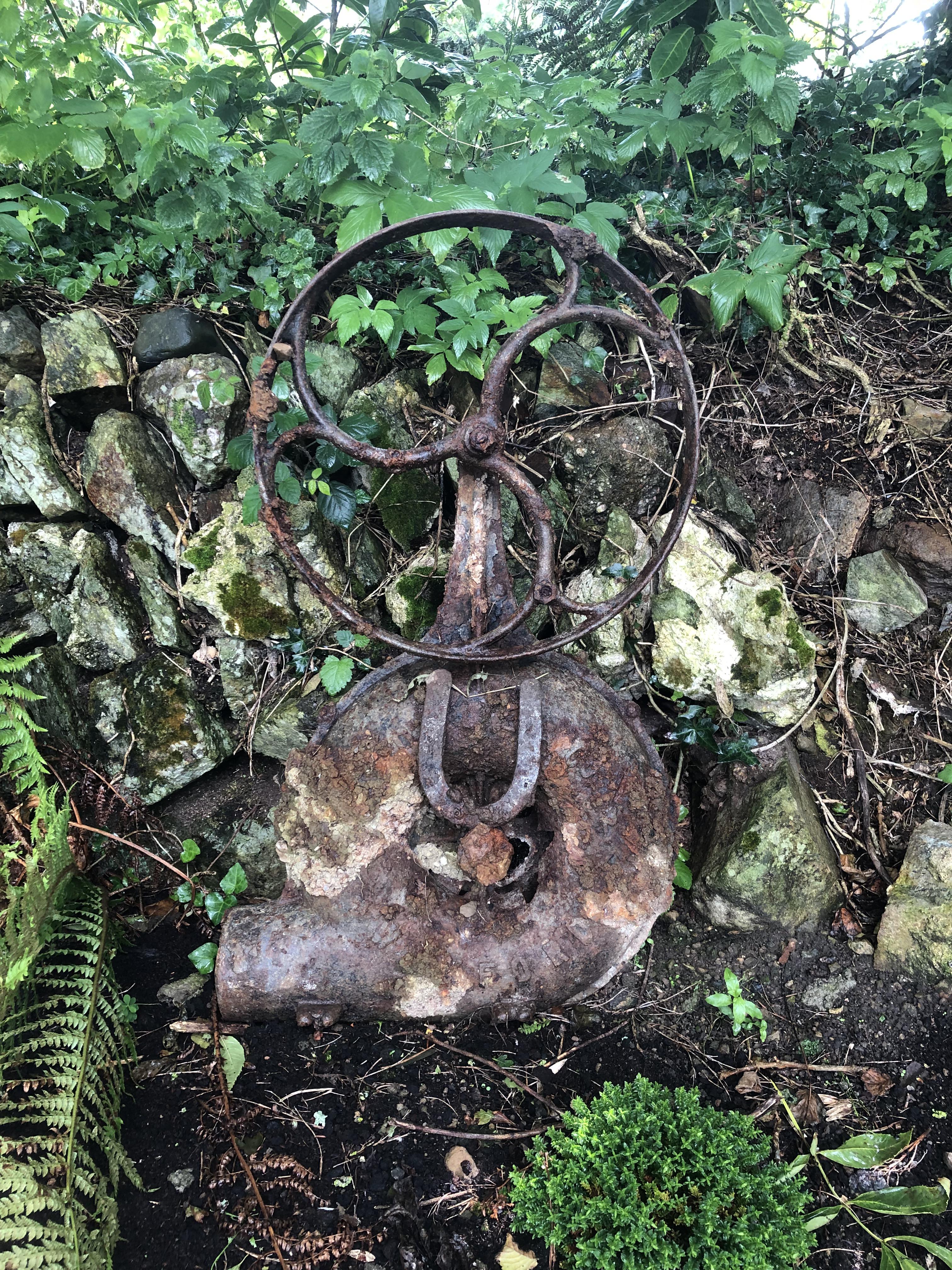 I dug this old cast iron fire bellows up while digging in our garden