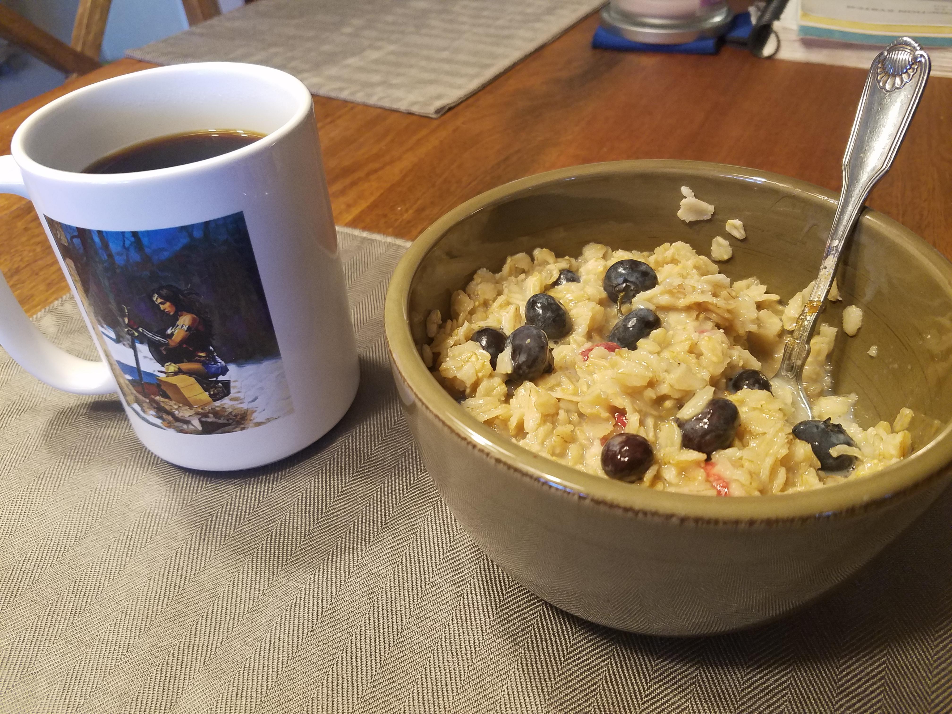 Coffee and oatmeal with blueberries and raspberries. It ain't much, but