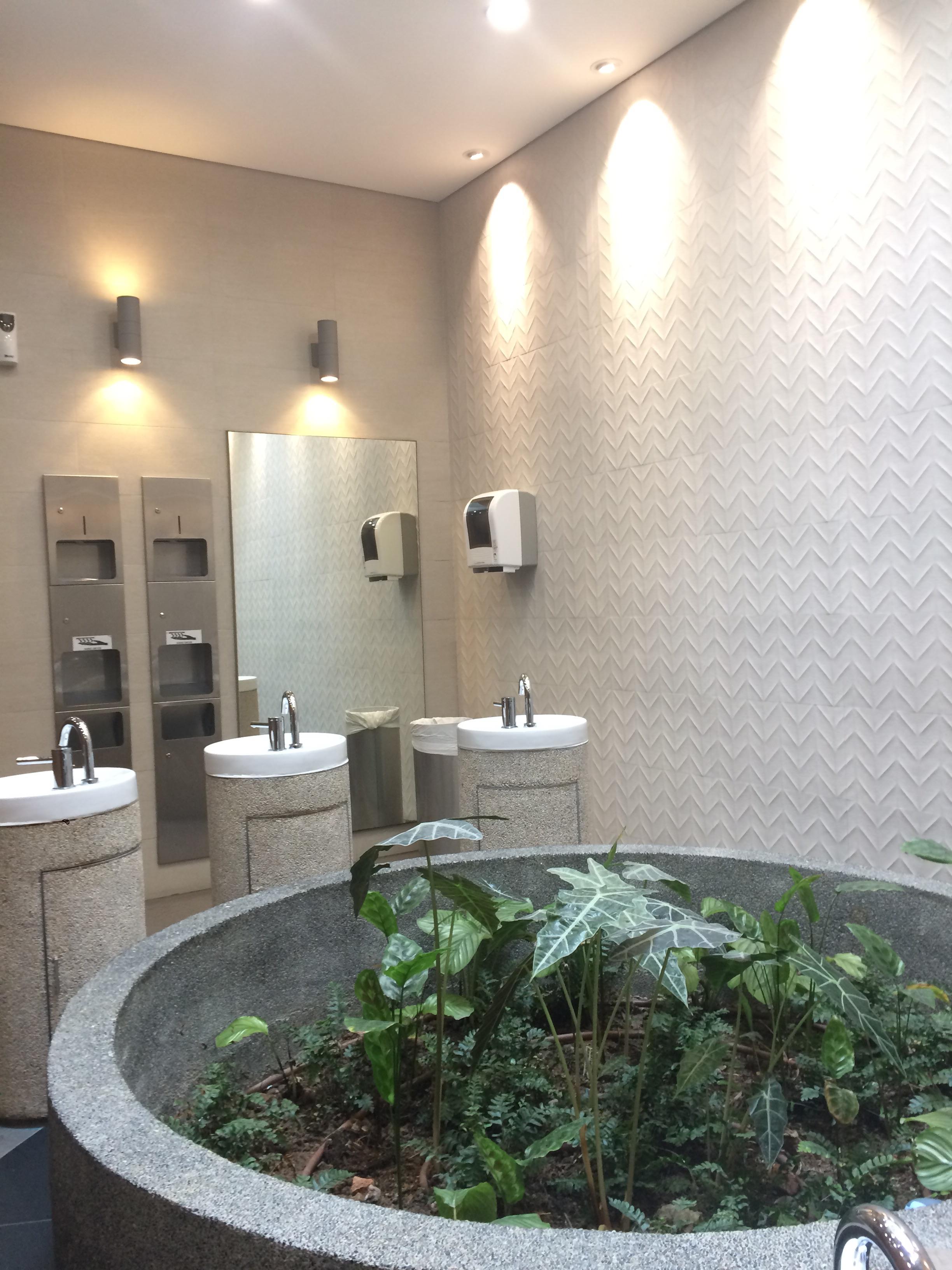 This public bathroom has an indoor garden to freshen the air