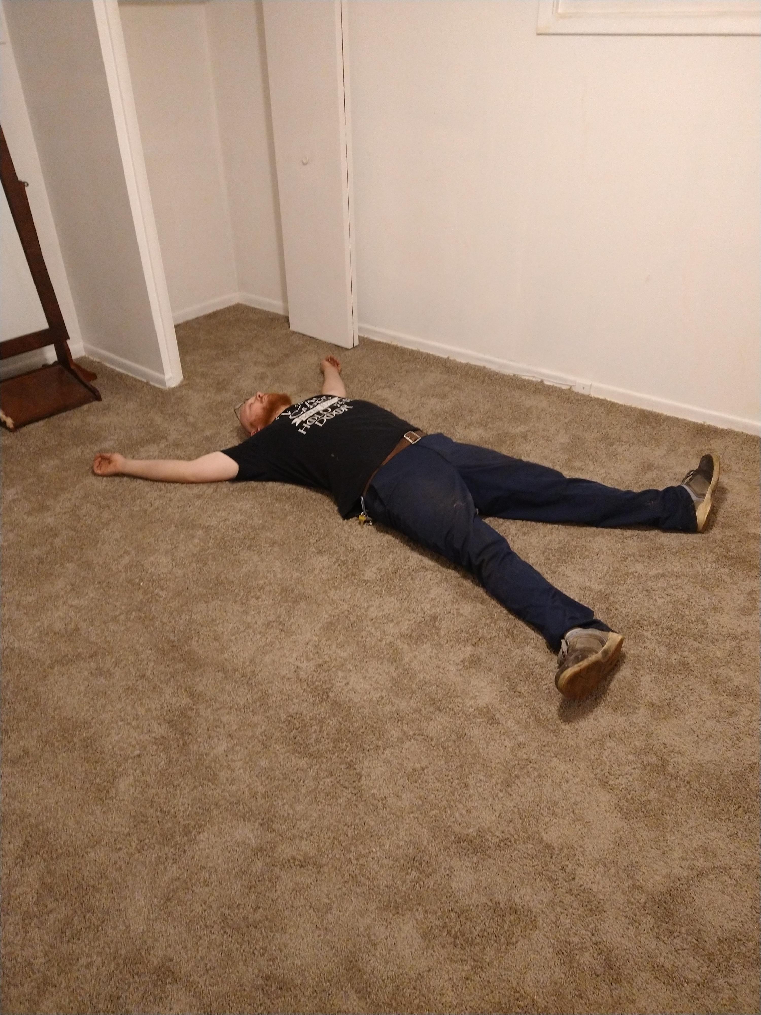 A picture of me, lying on my bedroom floor of the first home I ever