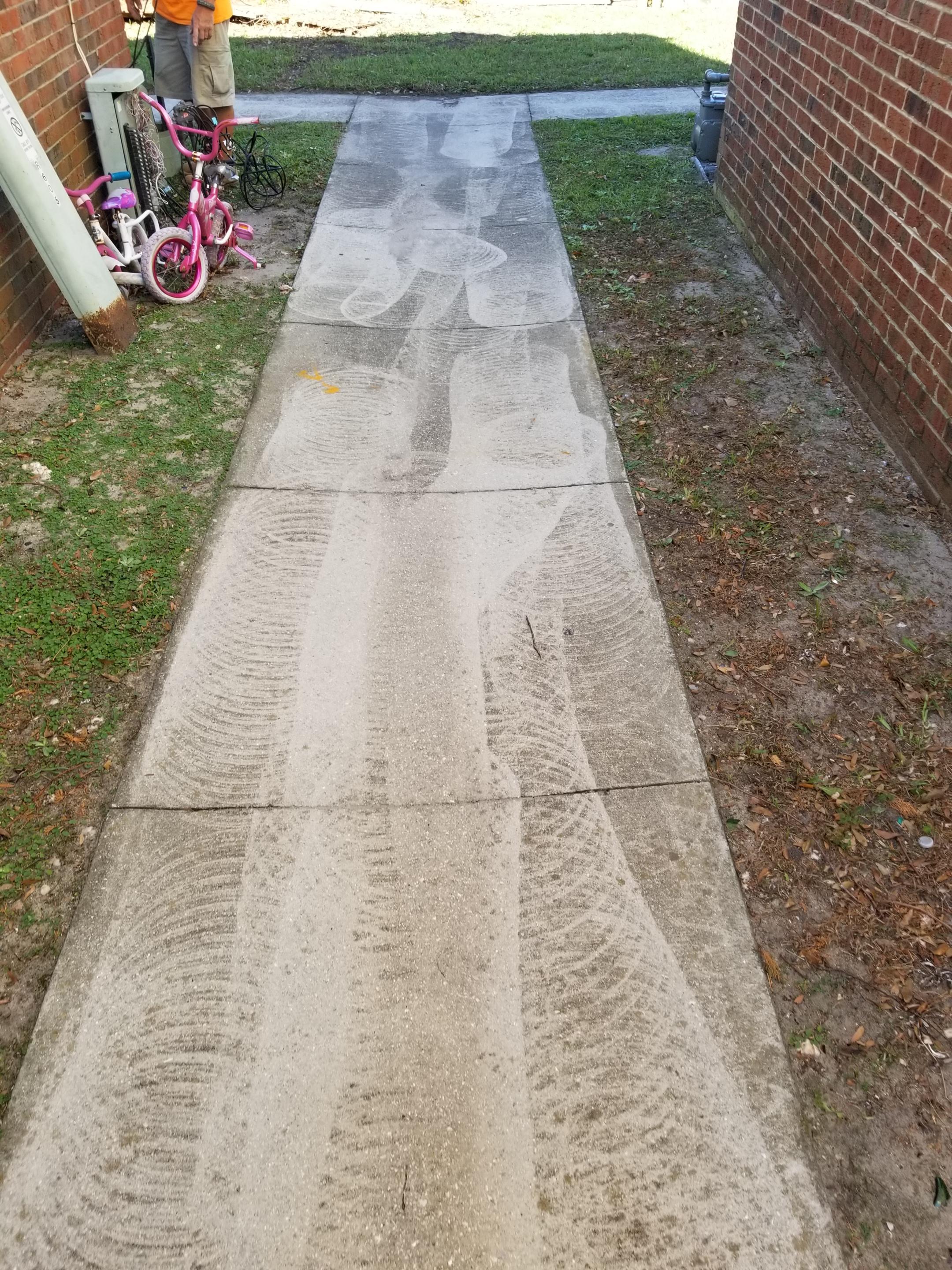 Guy hired a company to pressure wash the sidewalk outside their