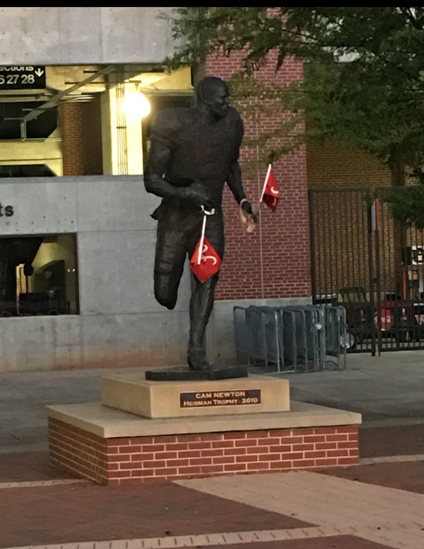 Someone put Alabama flags on Scam Newton Statue. r/rolltide