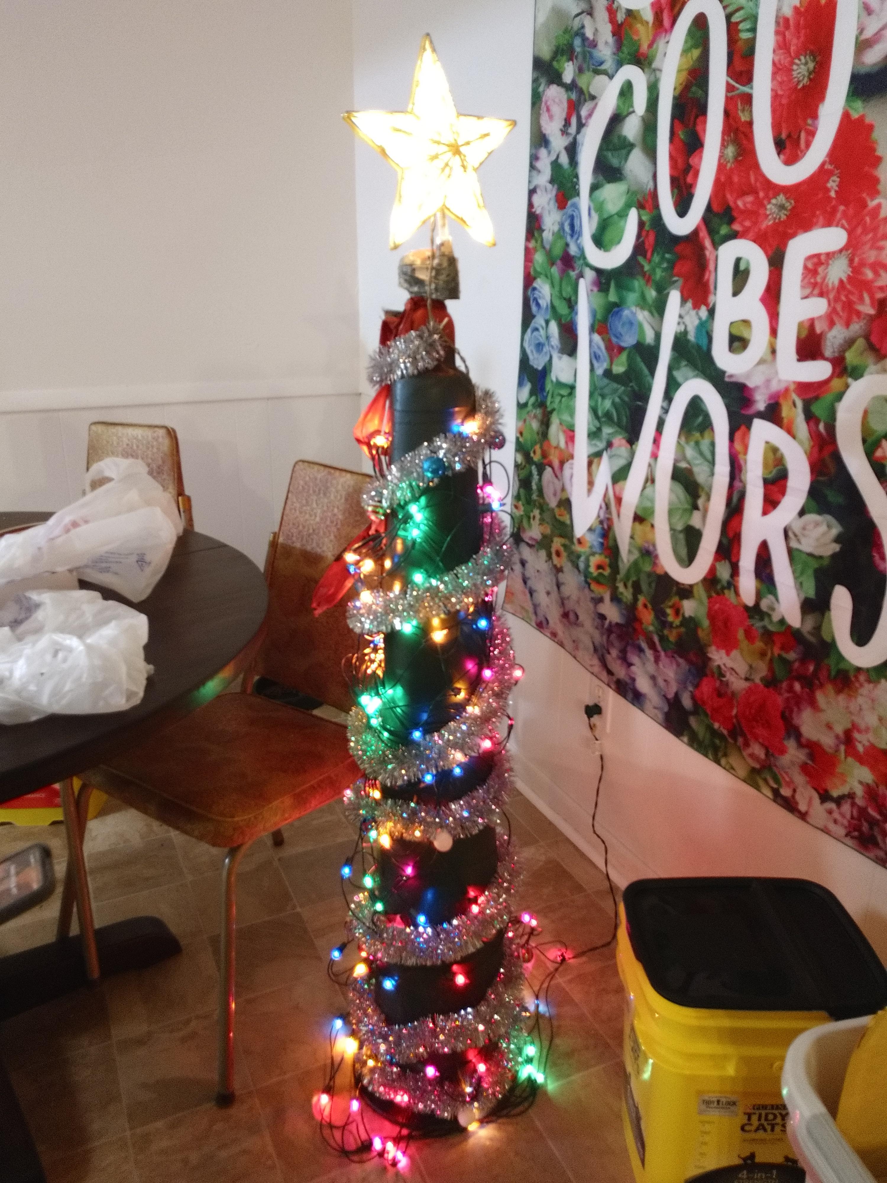 Me and my roommate made a Christmas tree out of a traffic cone. r