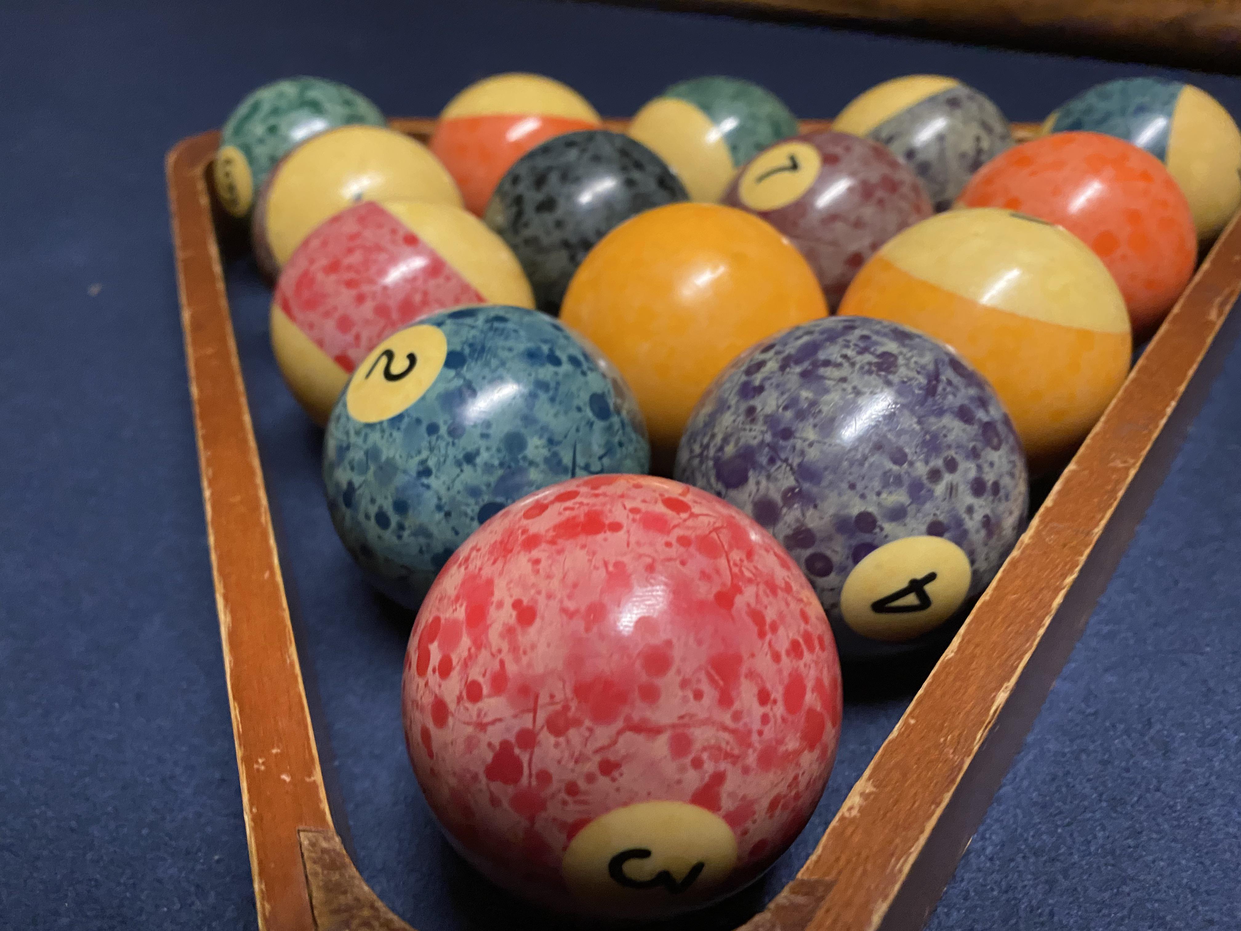 My roommate cleaned some old pool balls and now they look like