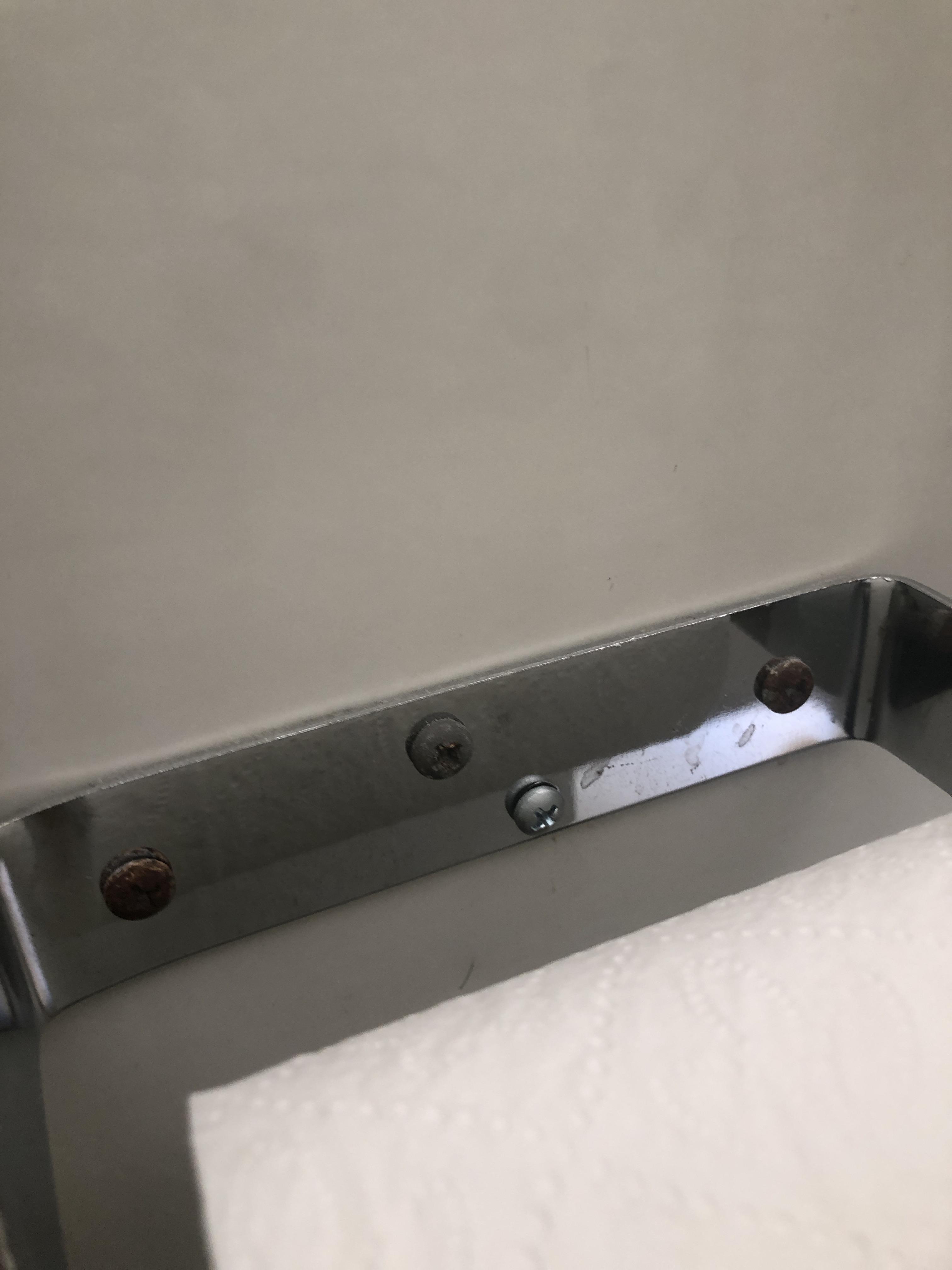 4 screws being used for one toilet paper holder. And 2 of them are