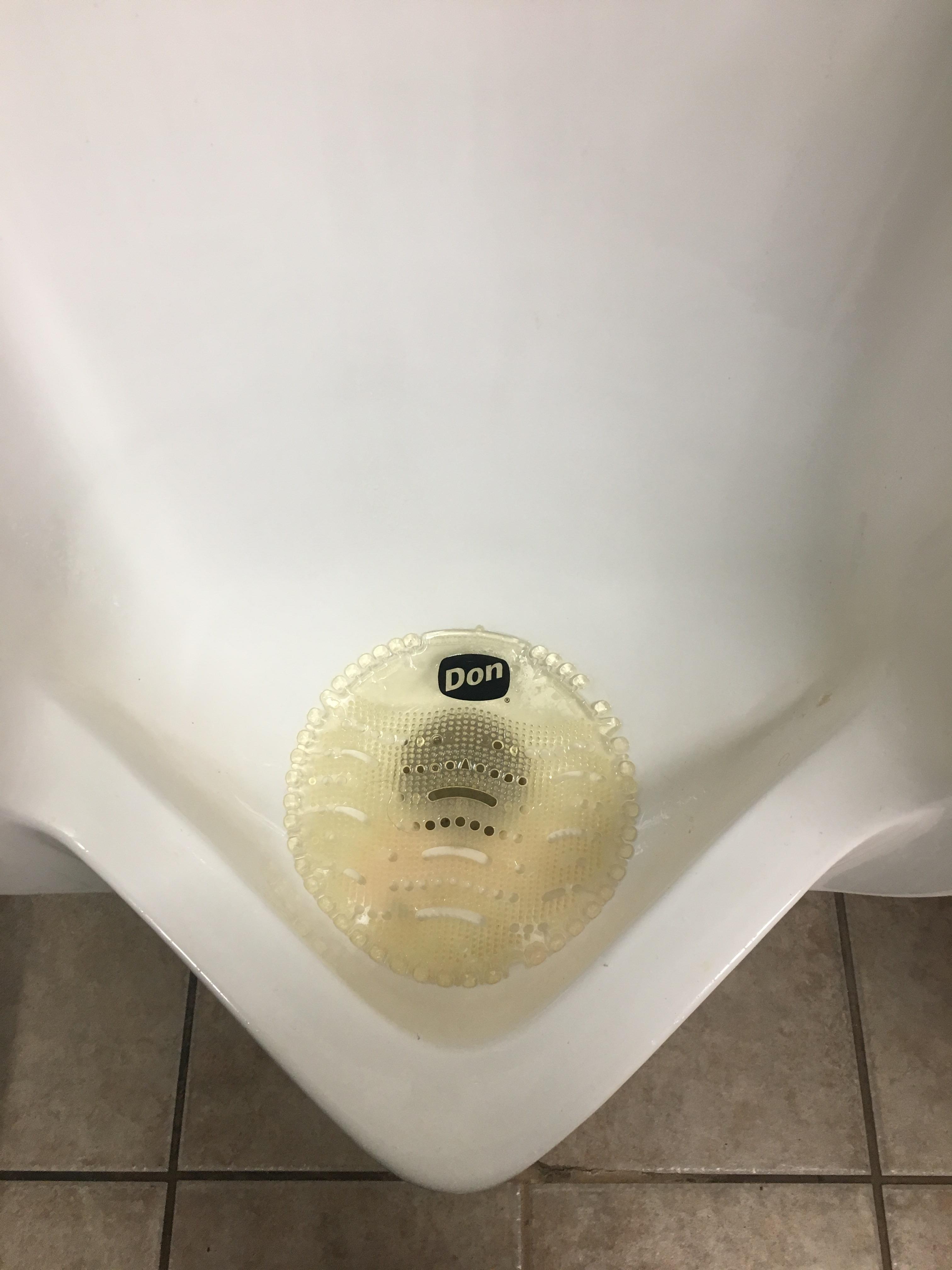 This urinal pad that truly hates it’s job. r/funny