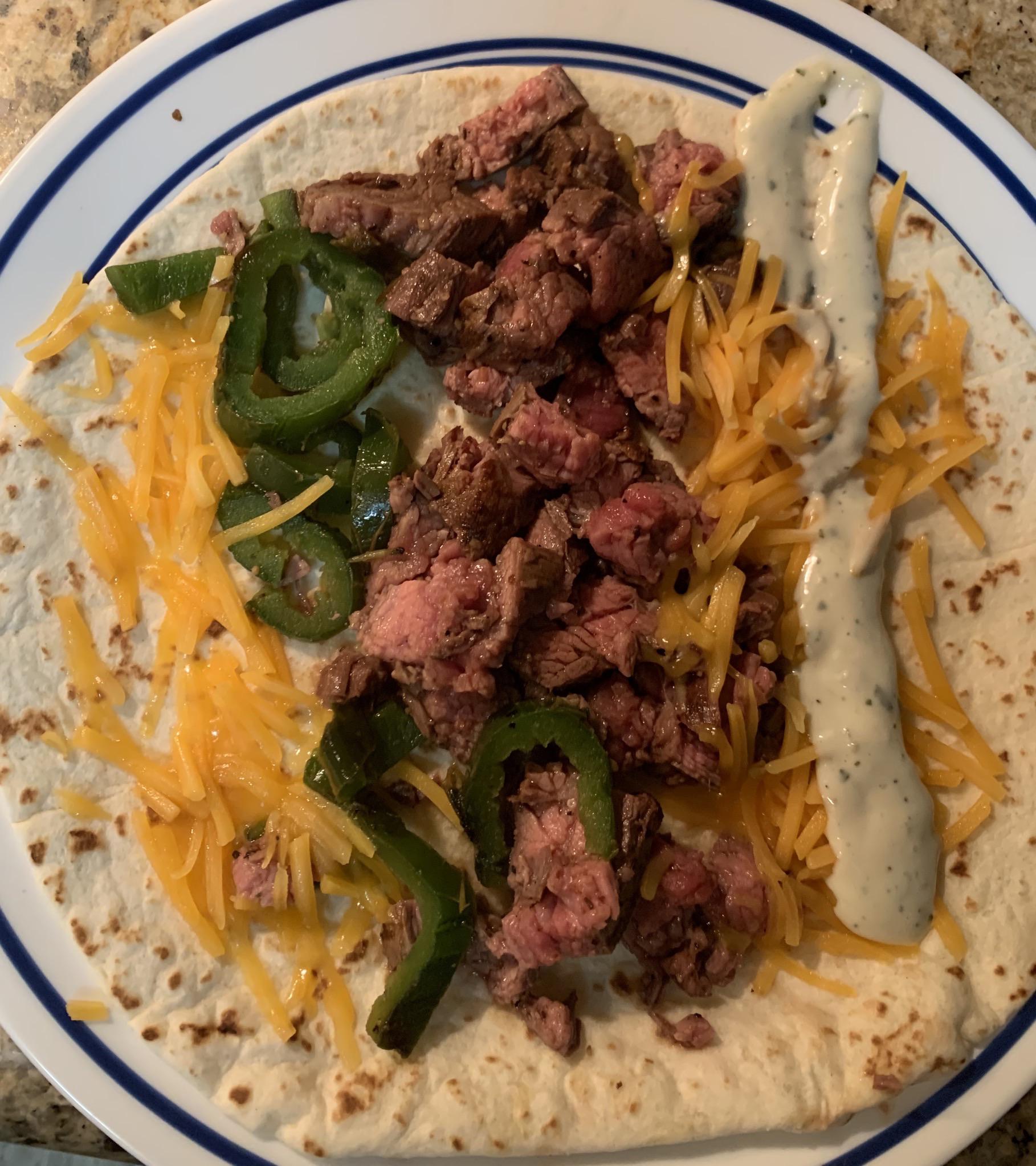 Grilled skirt steak, grilled jalapeño, cheddar, and avocado cilantro