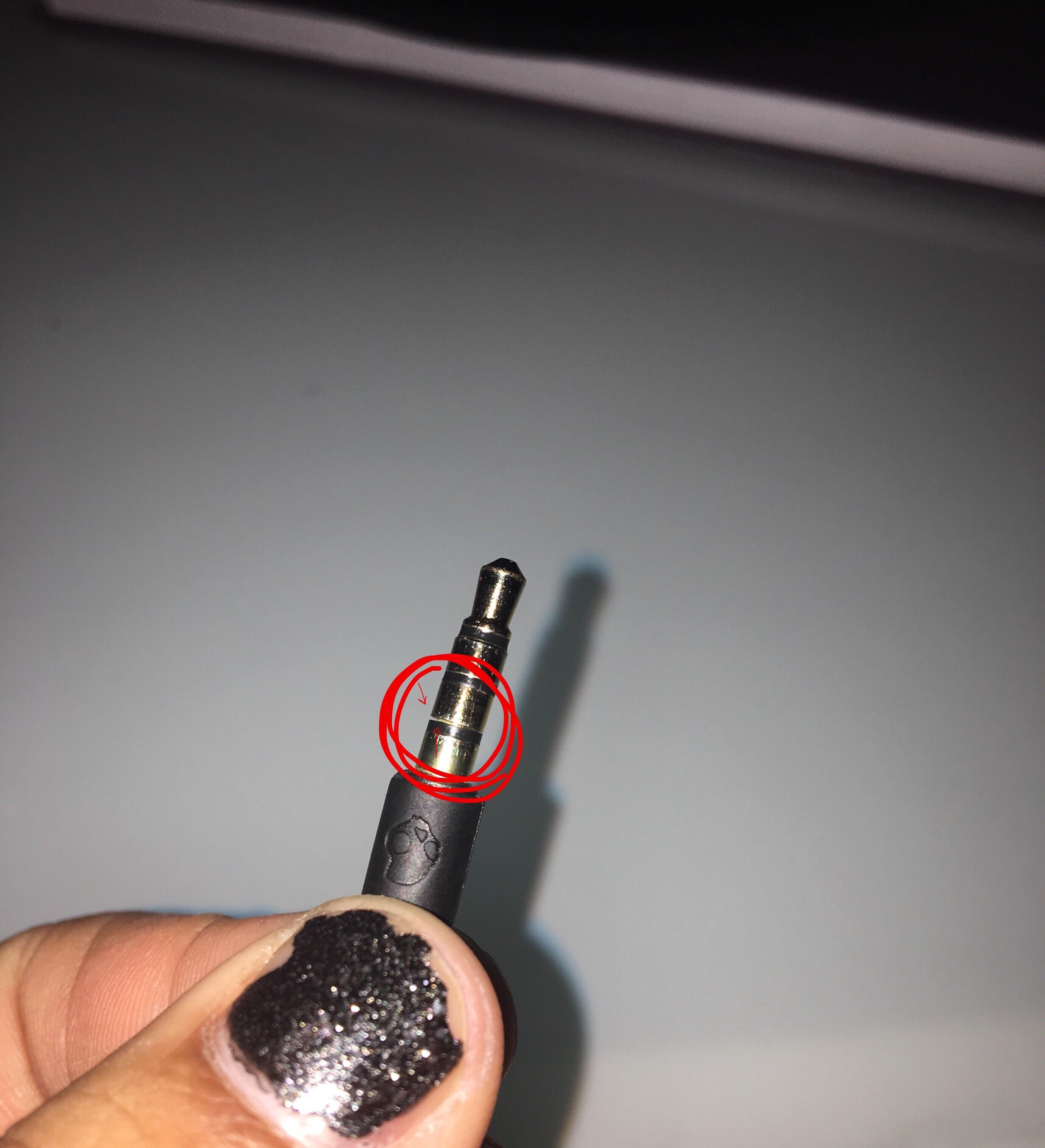 black wired skullcandy earphones only work when half plugged in. works