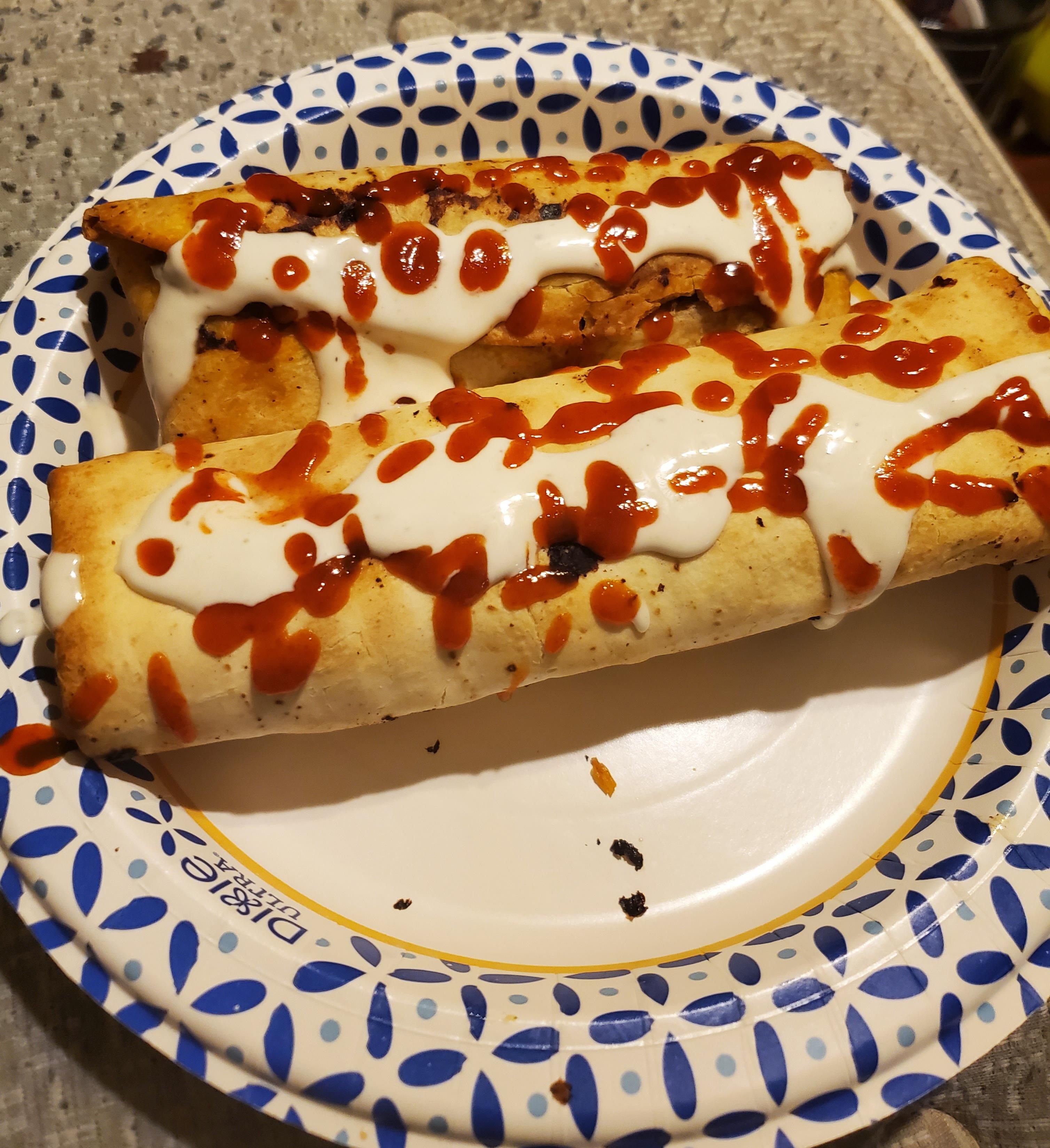 Two Microwave burritos toasted in the air fryer, topped with ranch & 'racha r/stonerfood