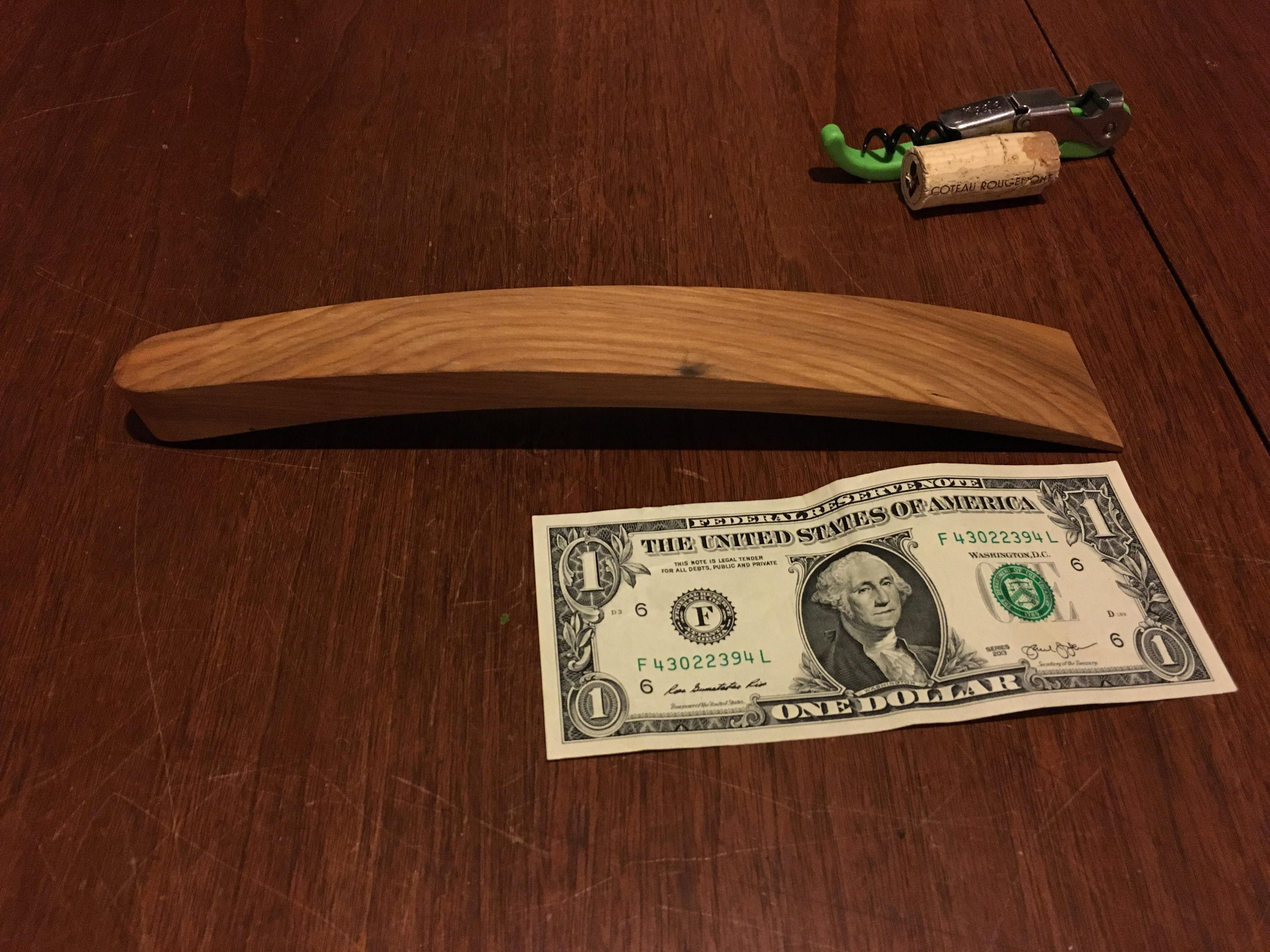 What is this wooden thing (dollar and corkscrew for scale) r
