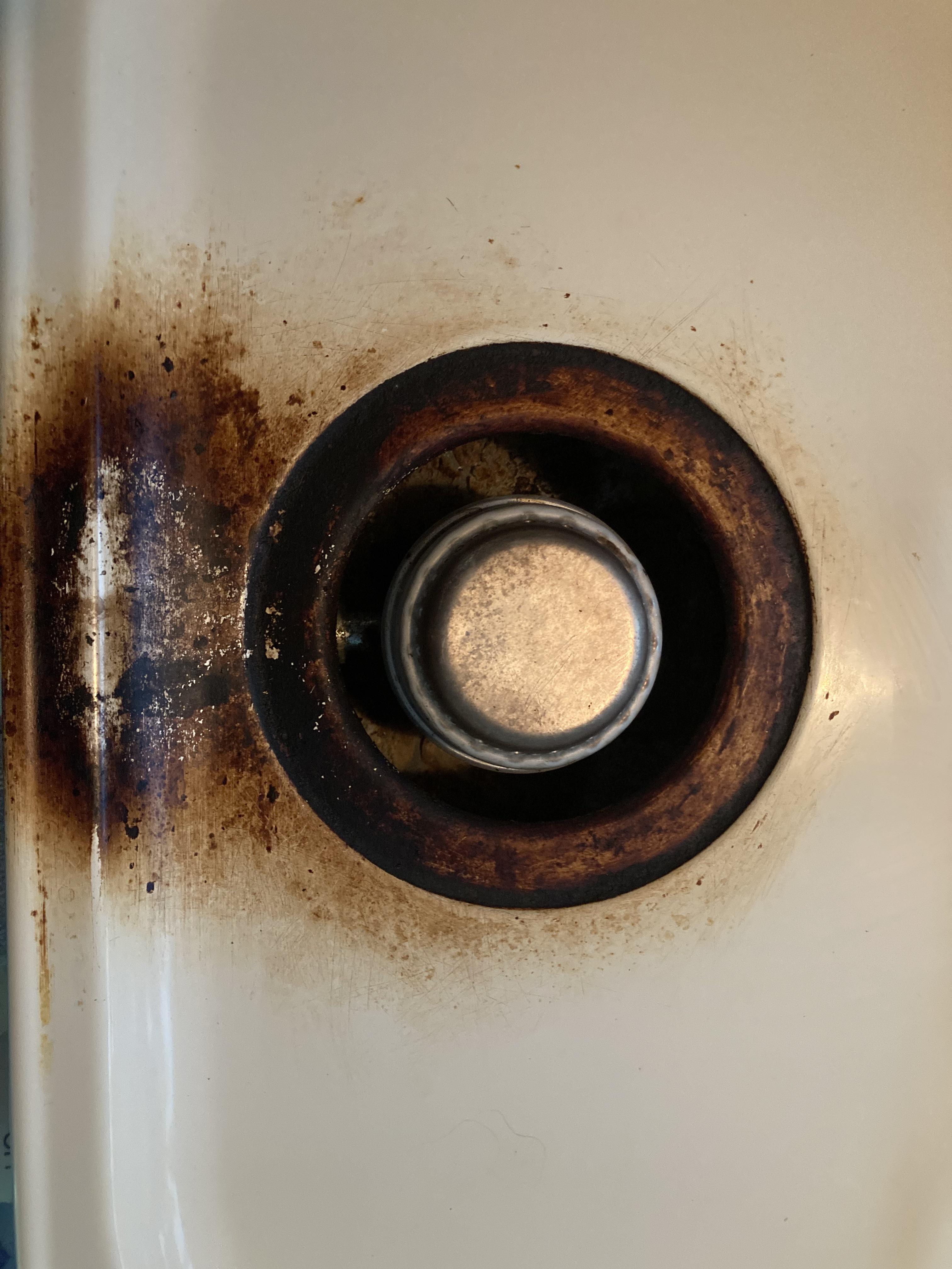 What can I do to clean this burner on my RV stove? I’ve tried steel