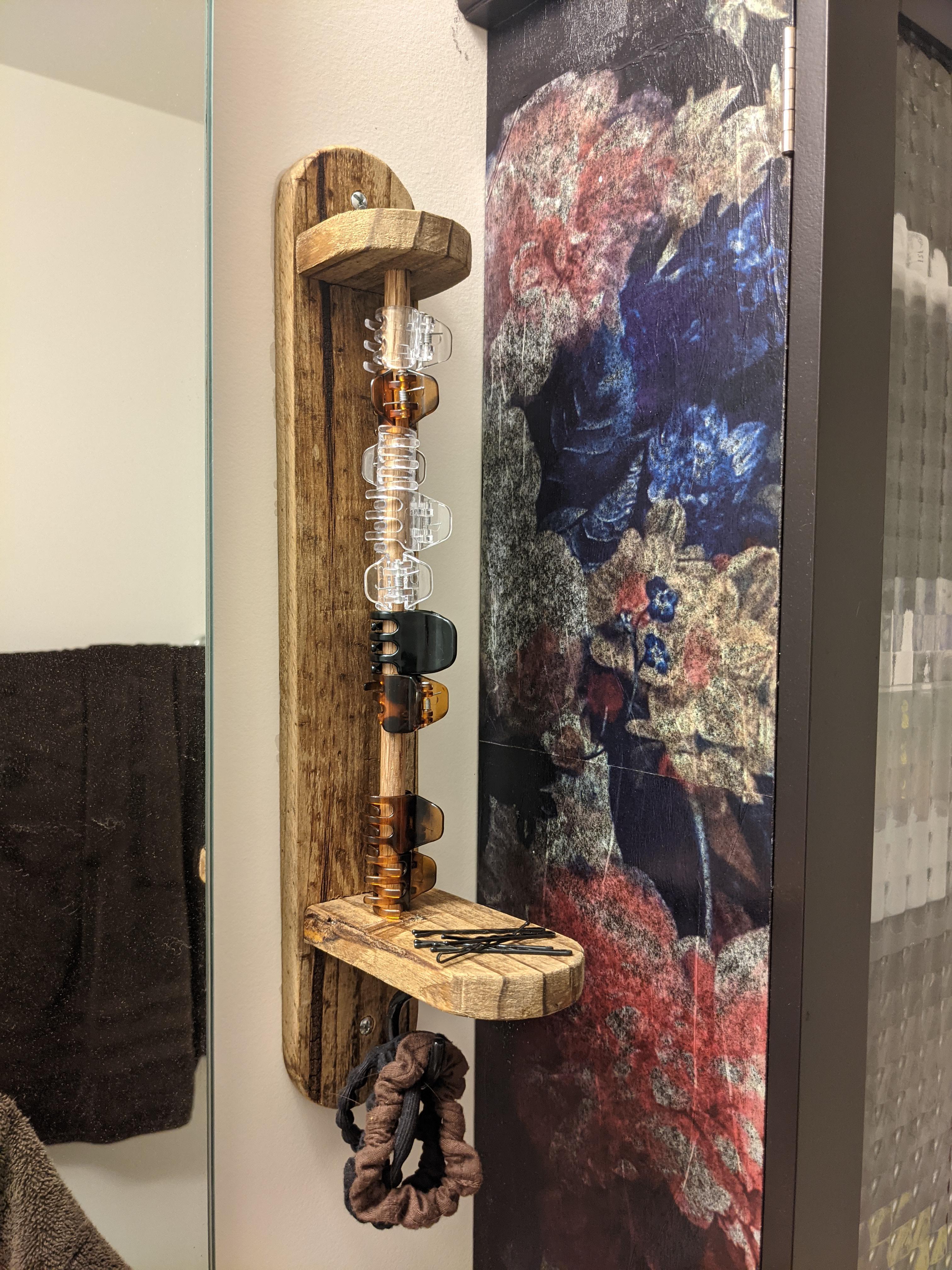 I made a hair accessory caddy to help reduce clutter. Reclaimed fence