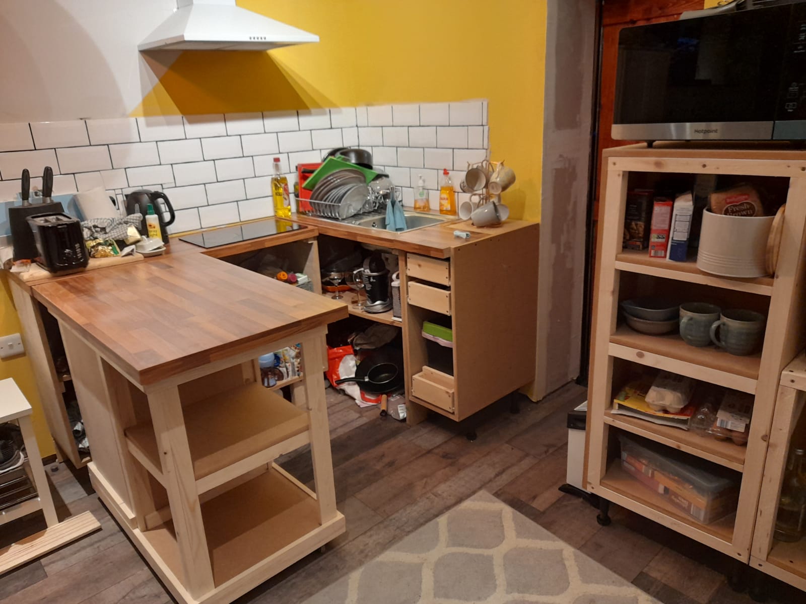 Diy kitchen for my tiny(ish) house. The peninsula is on wheels to save