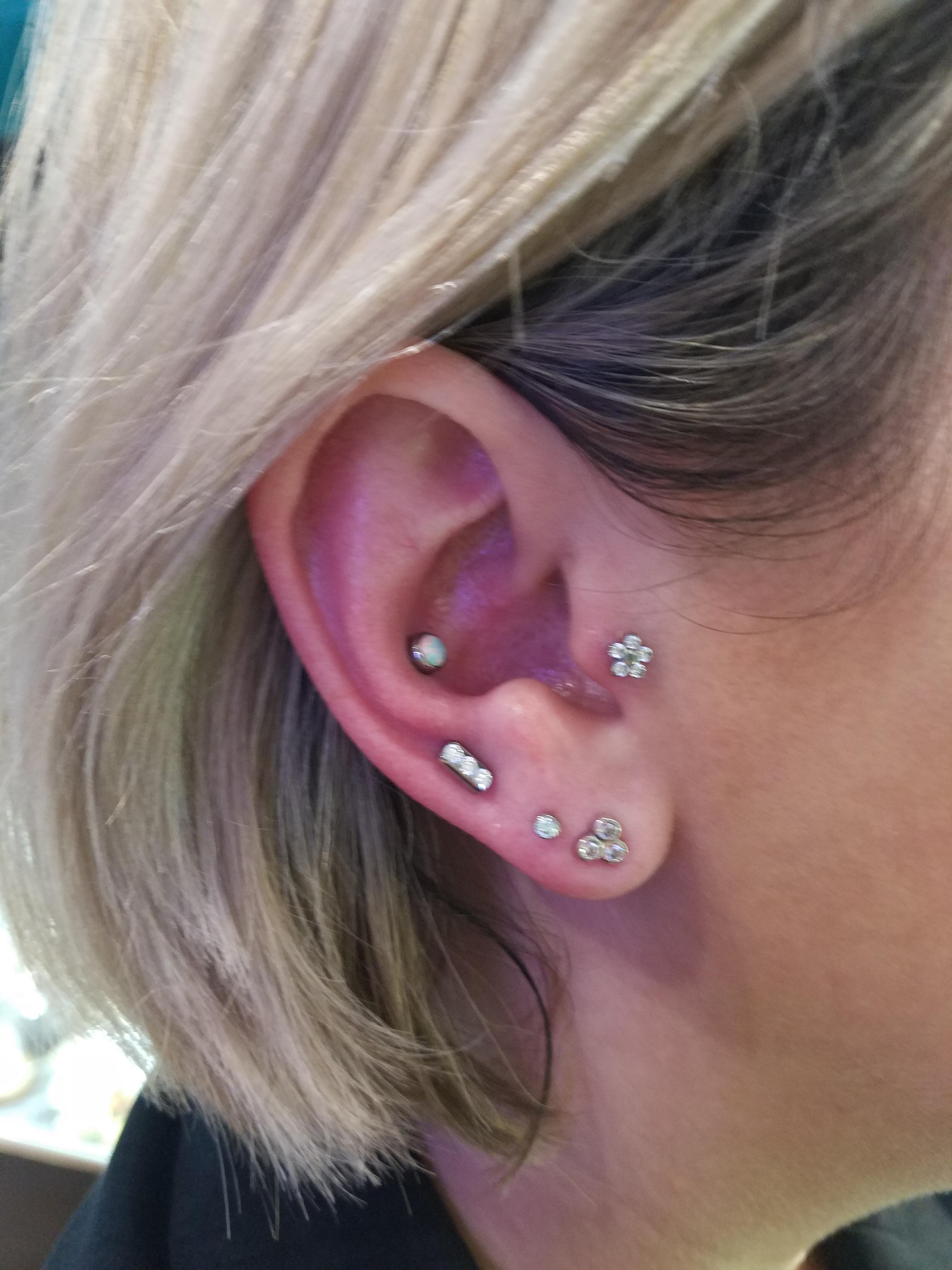 Finished my right ear with a high lobe and a conch piercing last night! ) r/piercing