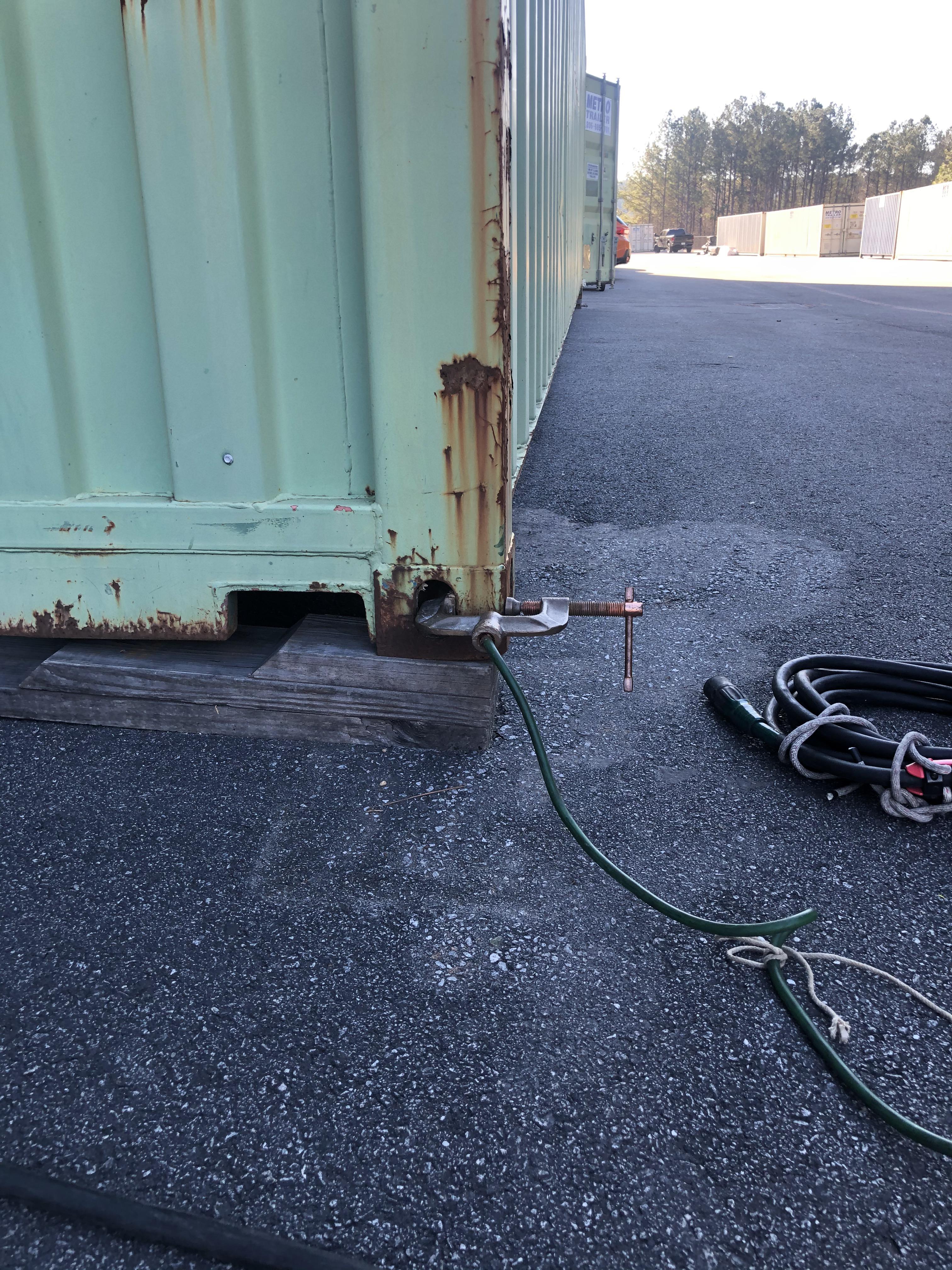 Grounding to a shipping container on wooden blocks r/OSHA