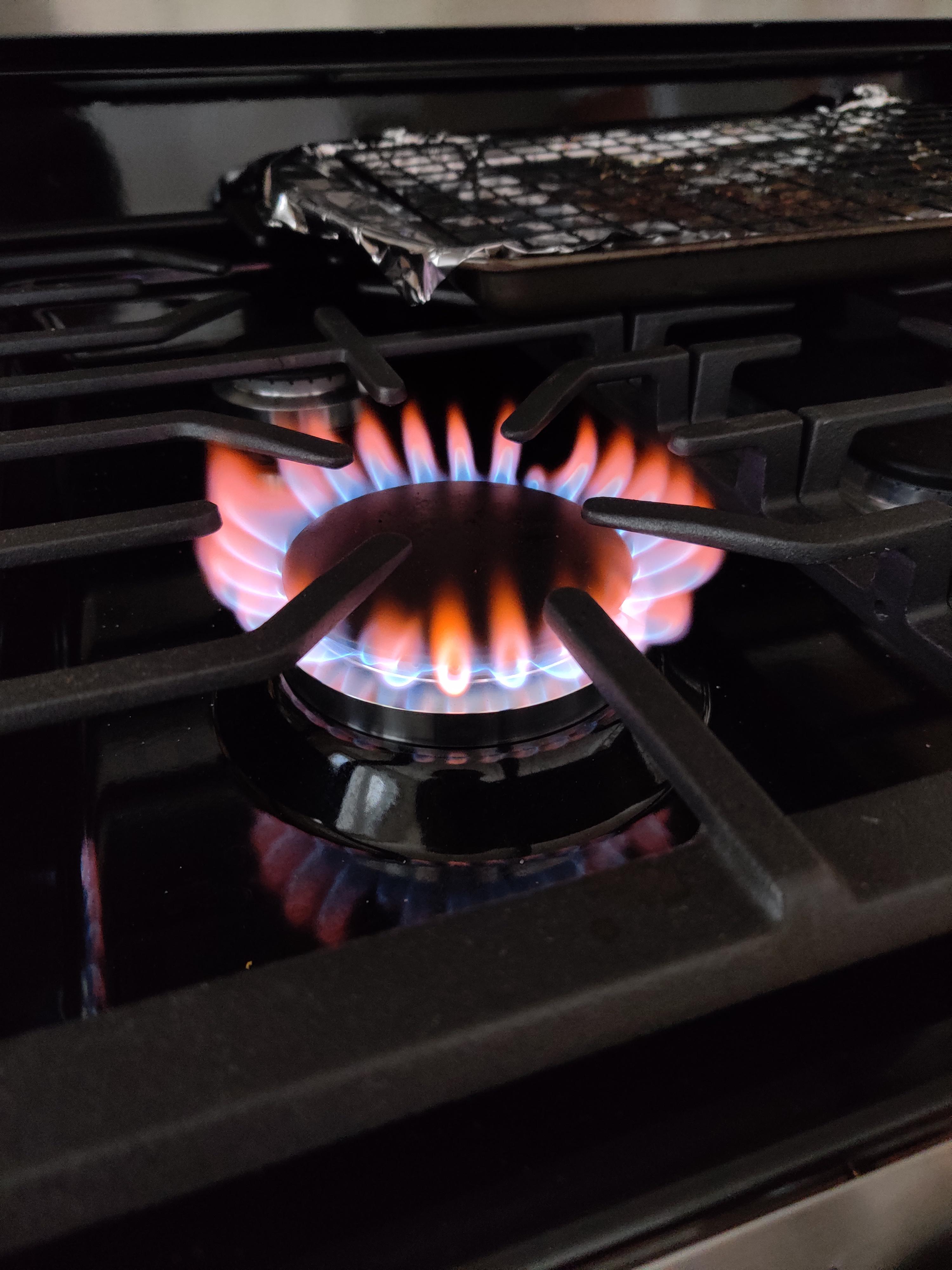 Flames on stove turn orange after running my ultrasonic humidifier. r