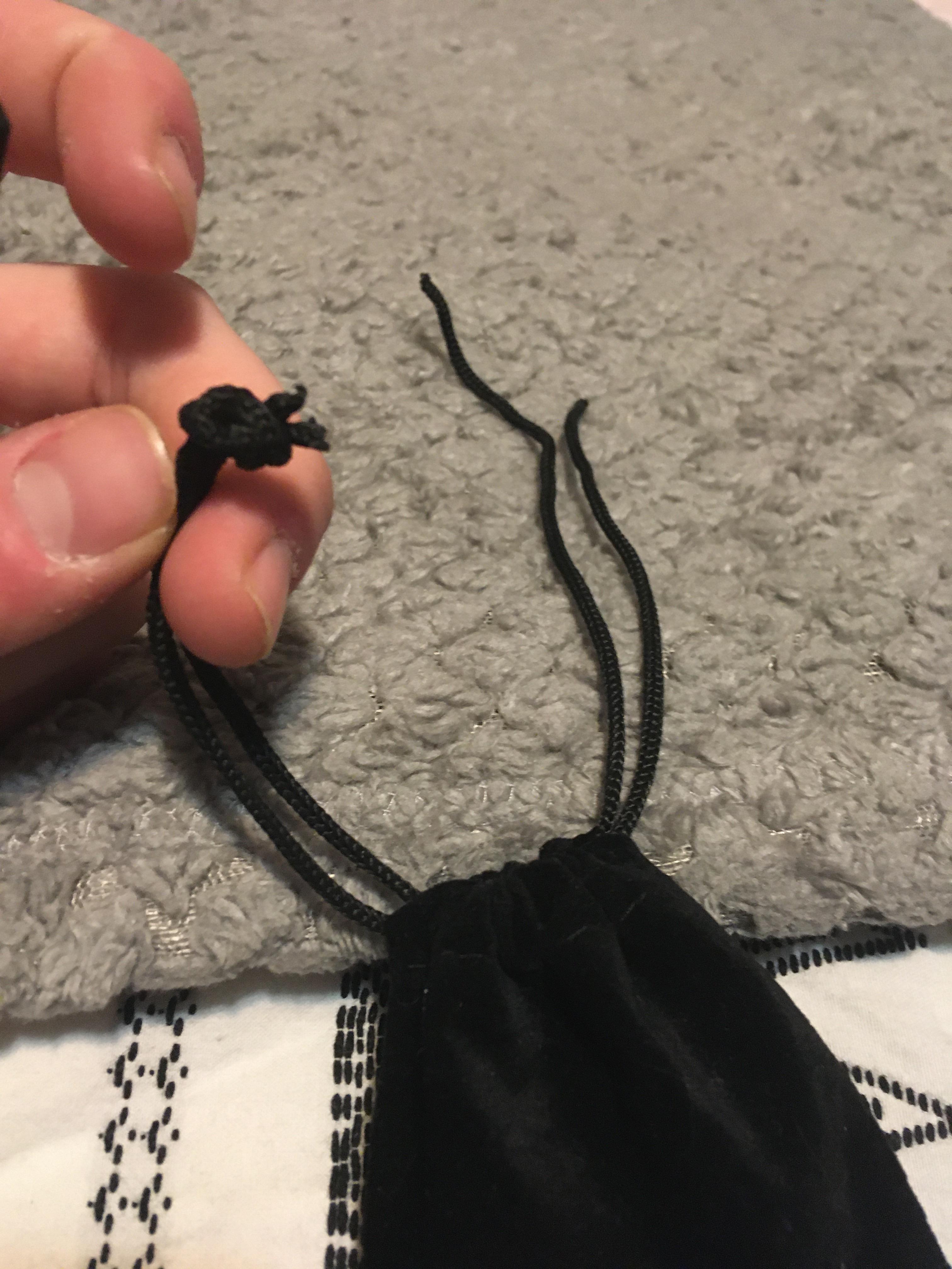 Can someone please help me tie the loose end on the right so that it