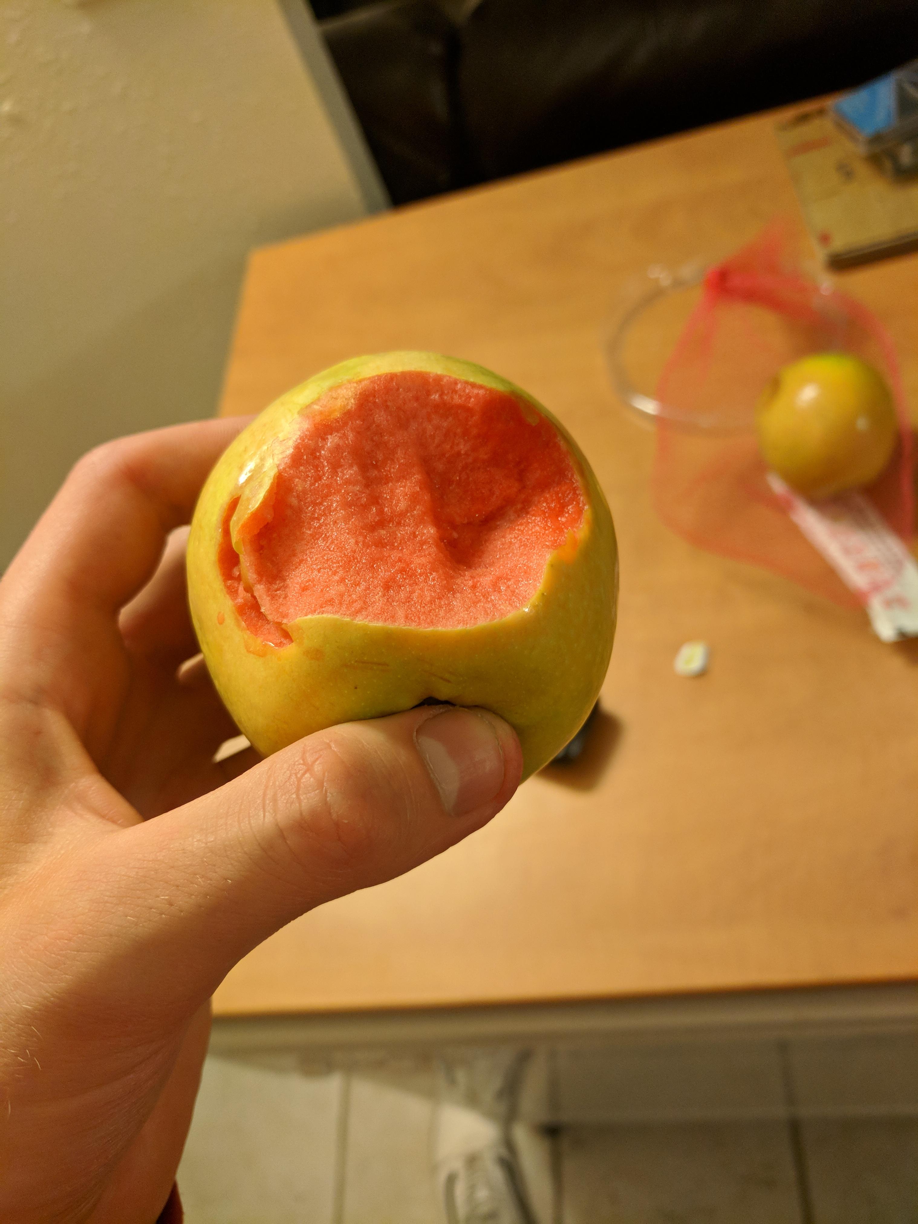 This damaged apple I bought at the grocery store is pink inside r/mildlyinteresting
