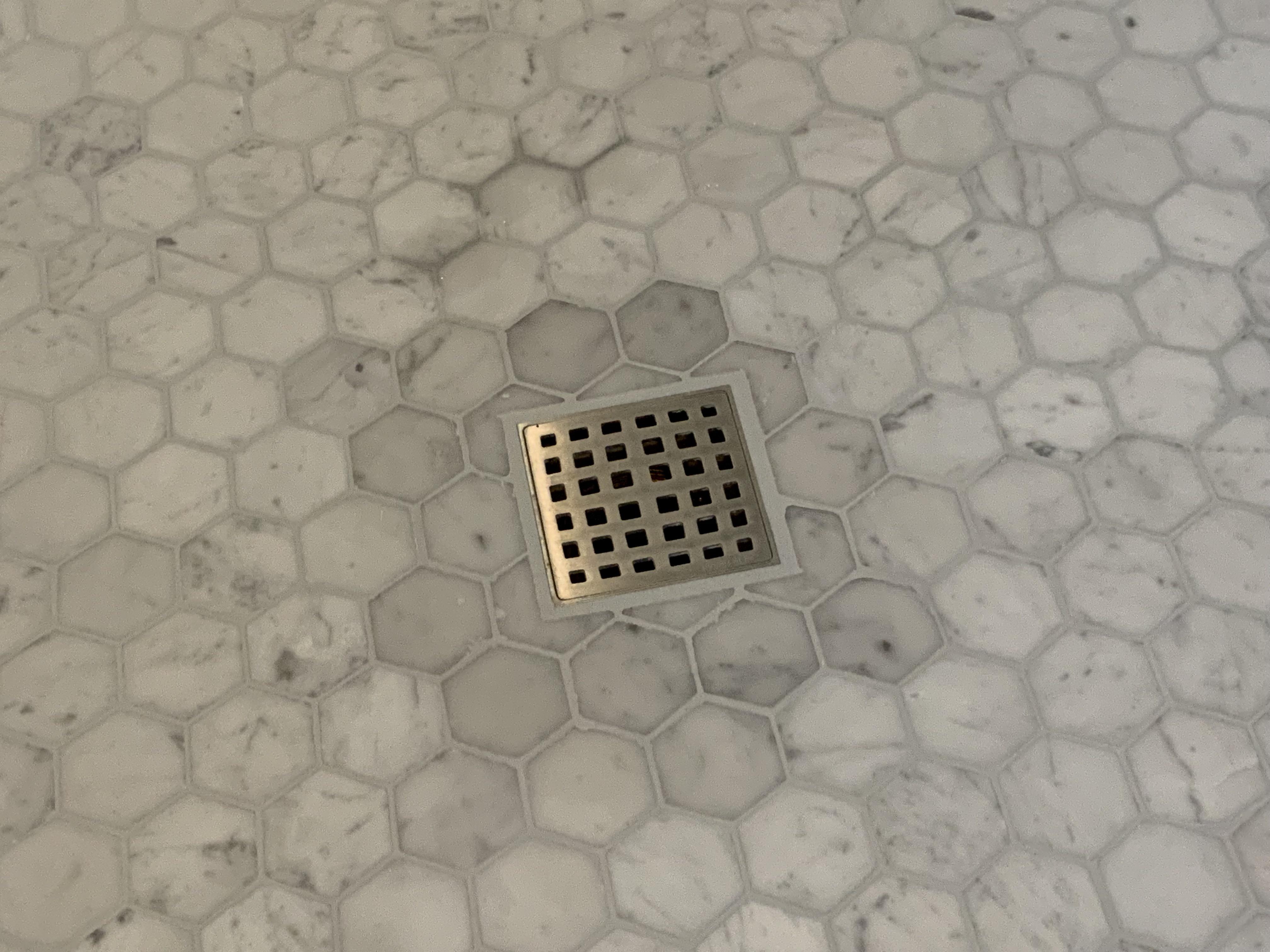 What causes this discoloration? r/Tile