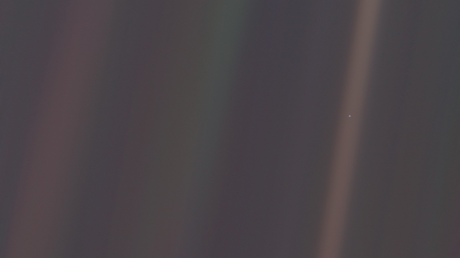 The Pale Blue Dot. The photograph of Earth taken on February 14