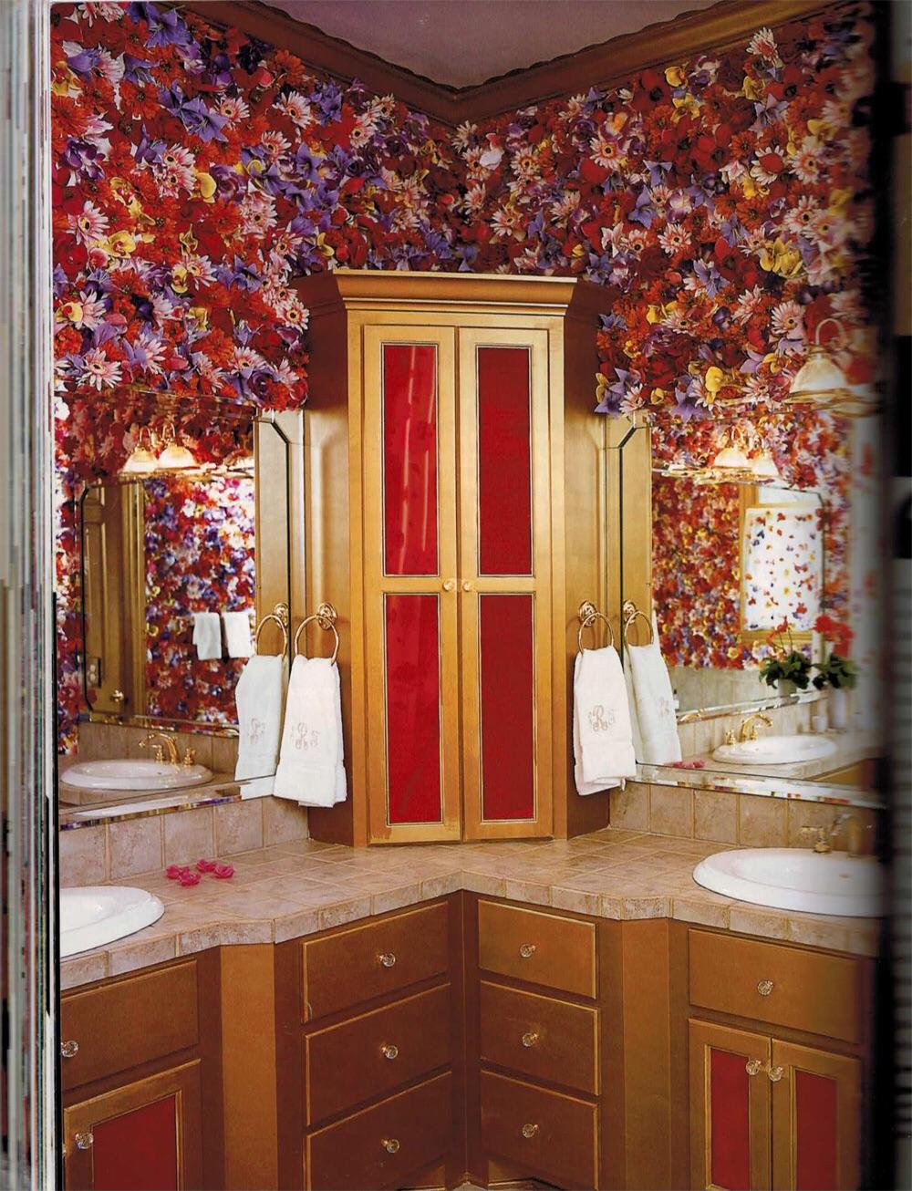 This bathroom with fake flowers stapled to the walls. ATBGE