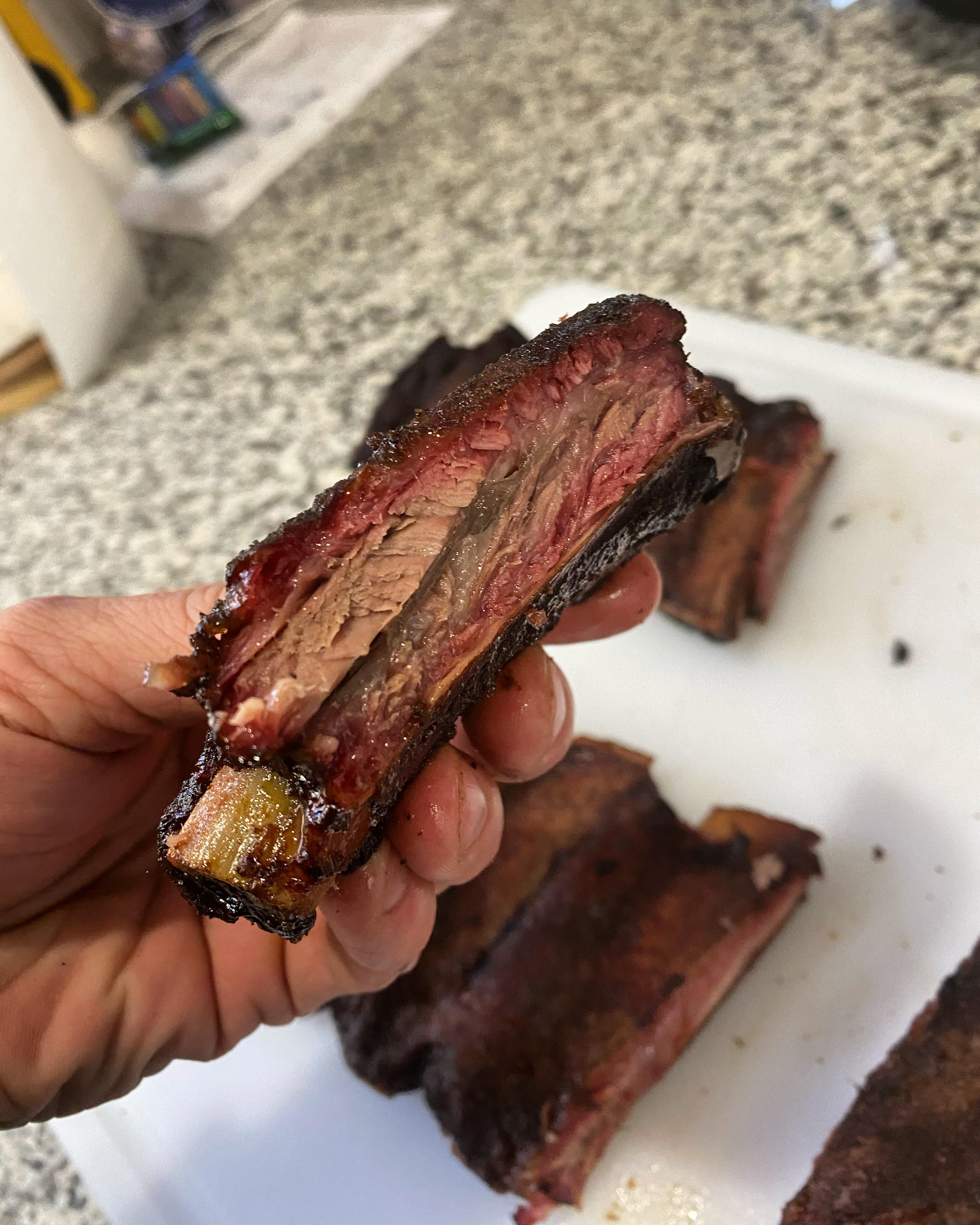 Brisket on a stick AKA beef back ribs smoked over post oak on the er