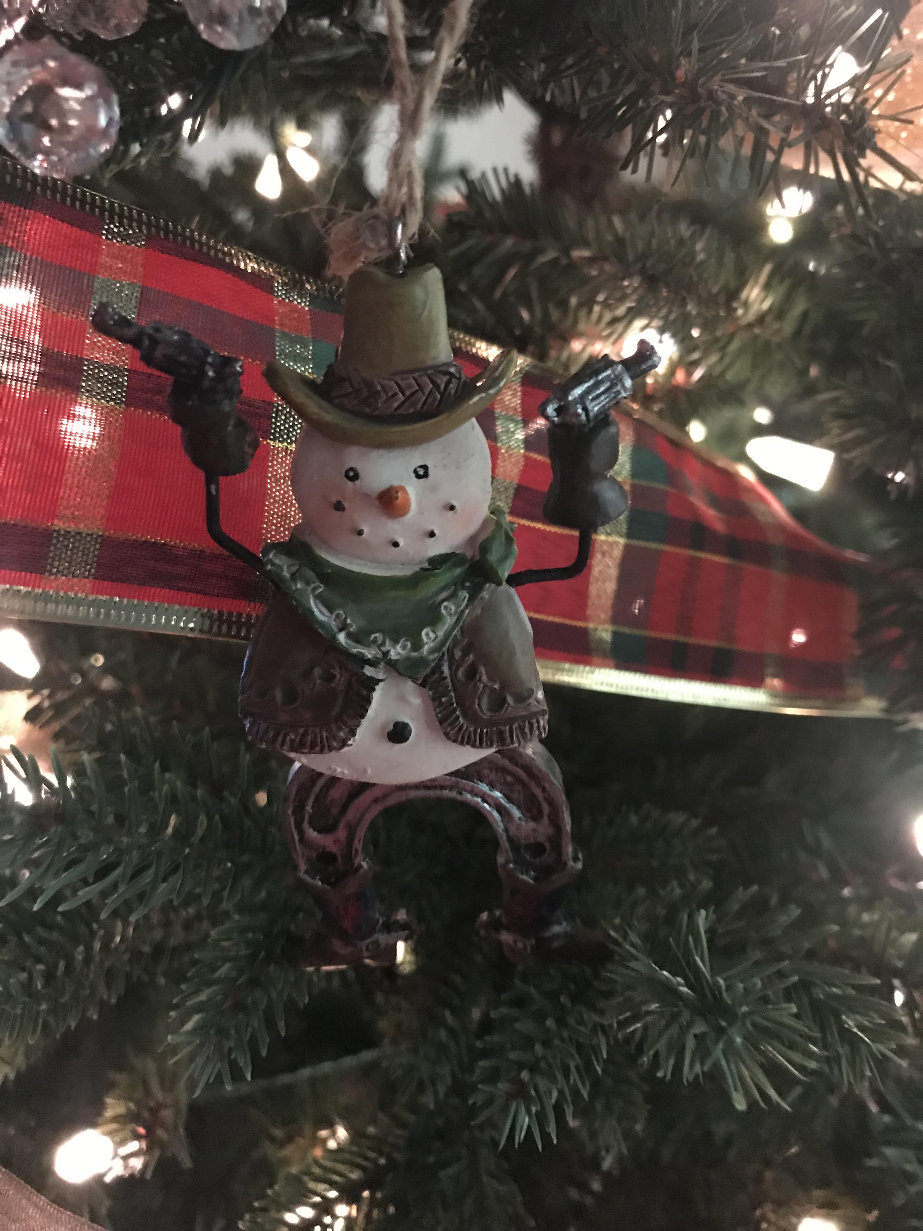 Bought this at HEB. A sno man with revolvers lol. Fitting for TX 🤠 r