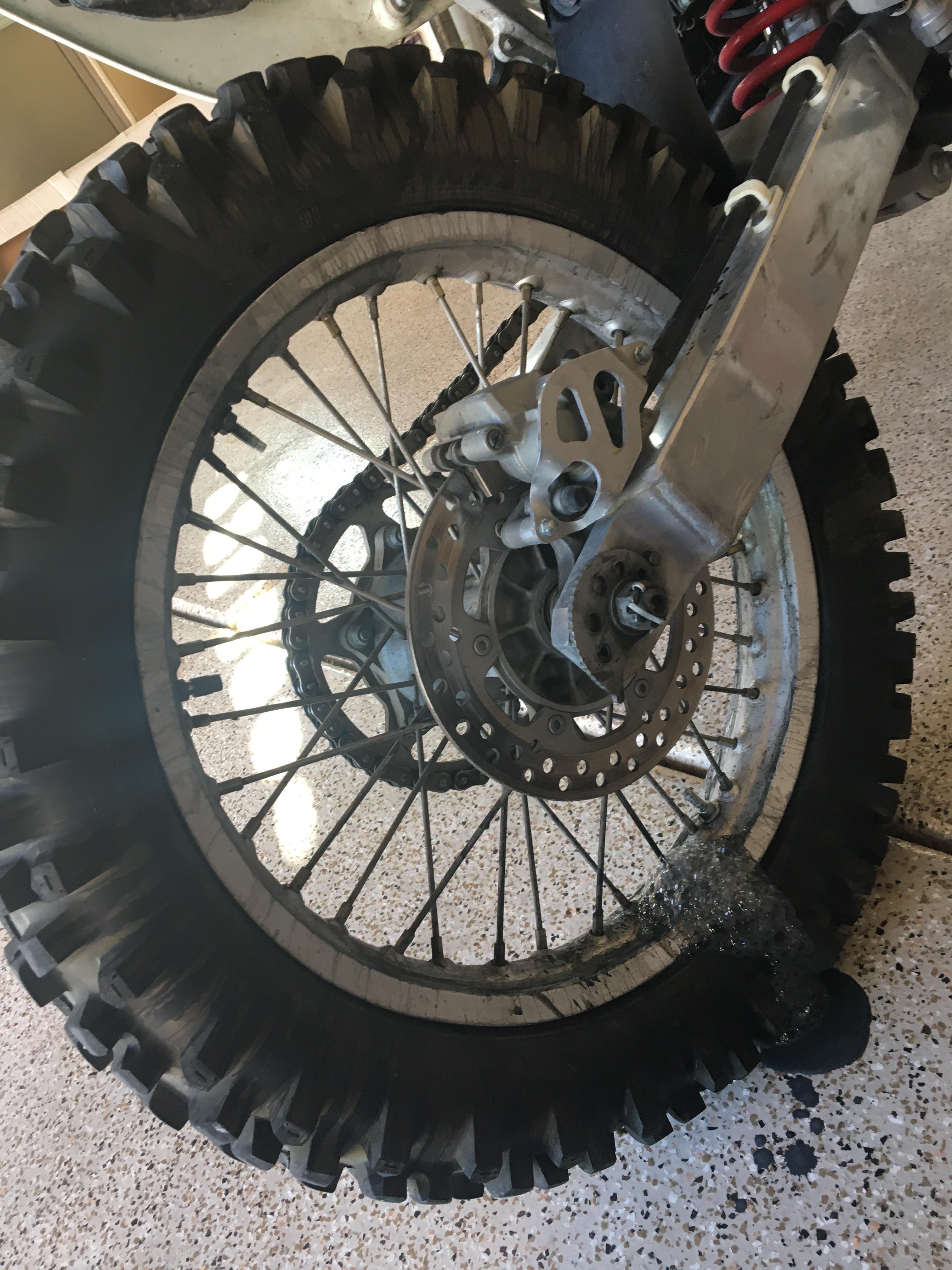 Tire/ rim leaking fixaflat. Seems to be leaking air/ fluid from the
