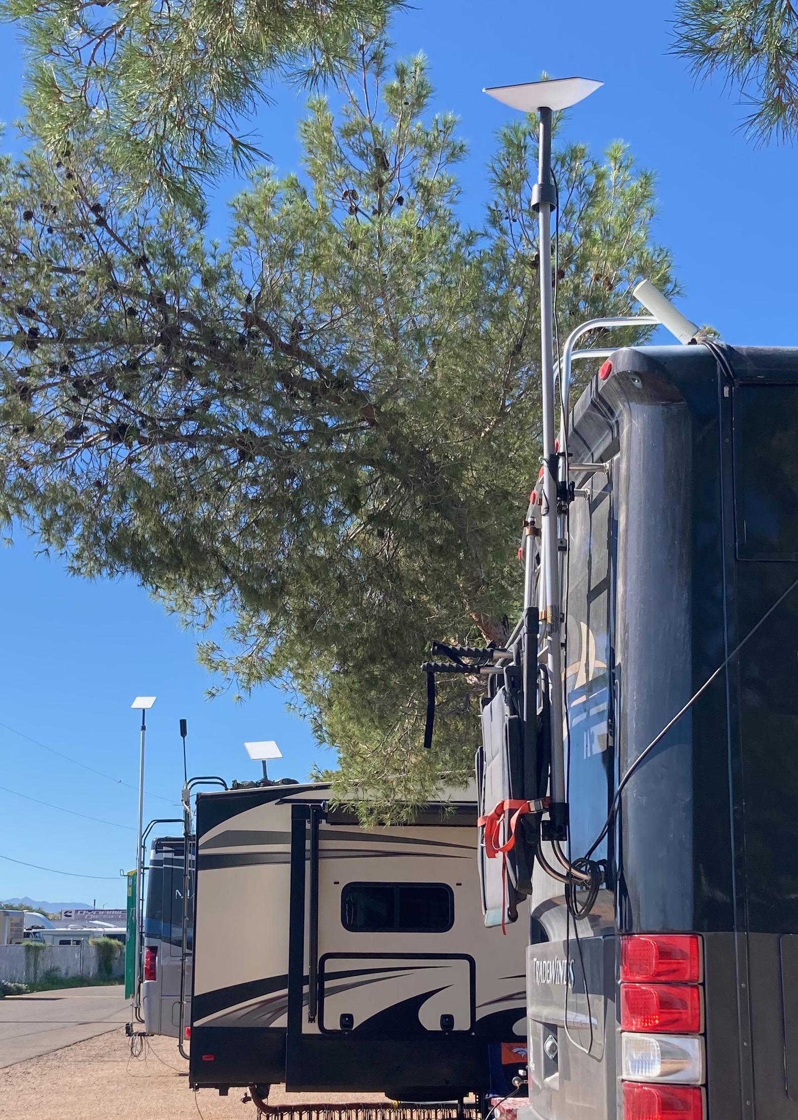 Three RVs in a row with Starlink Dishys in Kingman, Arizona, USA. All