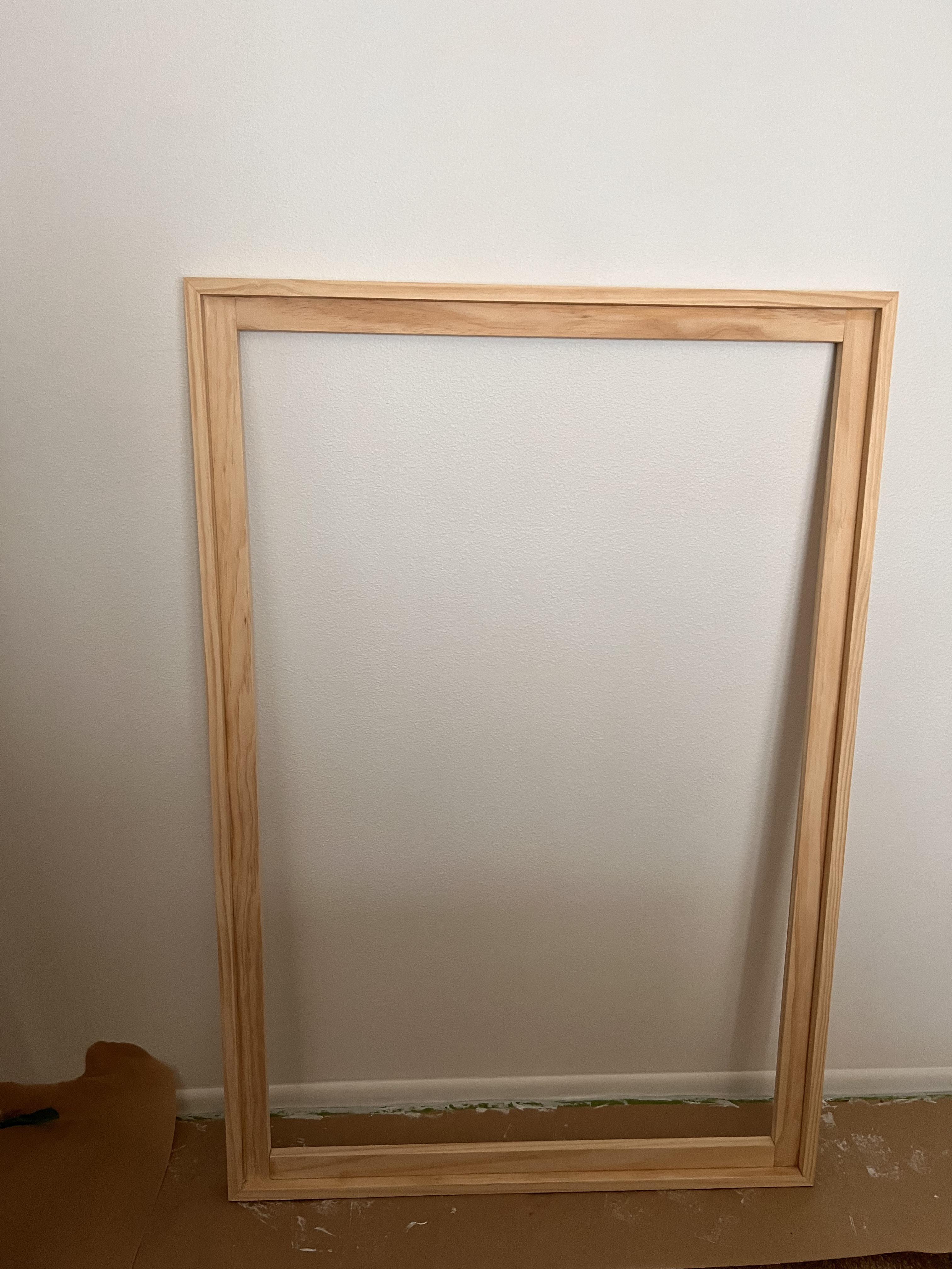 What should I place my pinewood frame on outside to protect it from