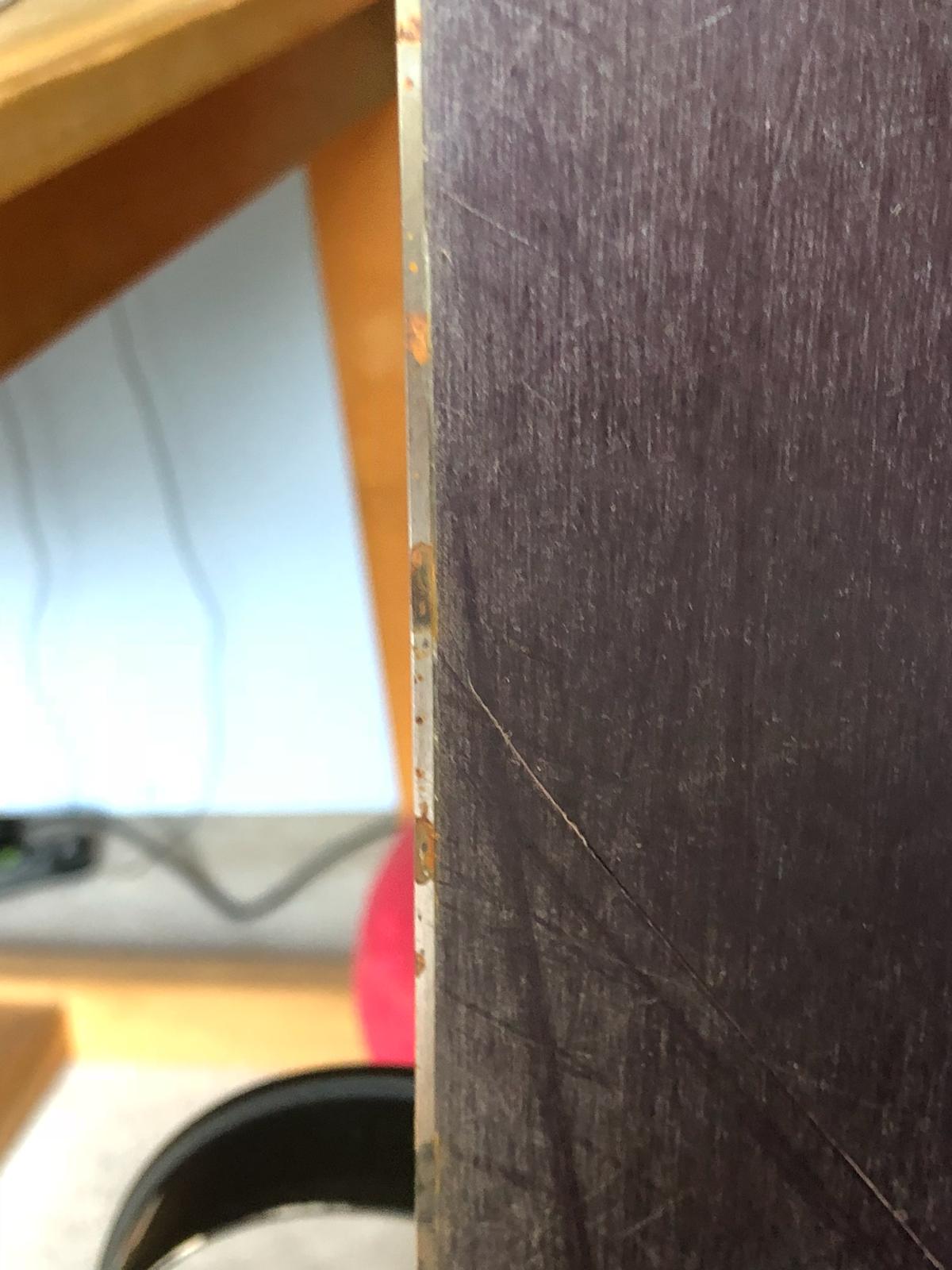 There's this type of damage in the edge of my snowboard. I'm not sure if it's rust or impact