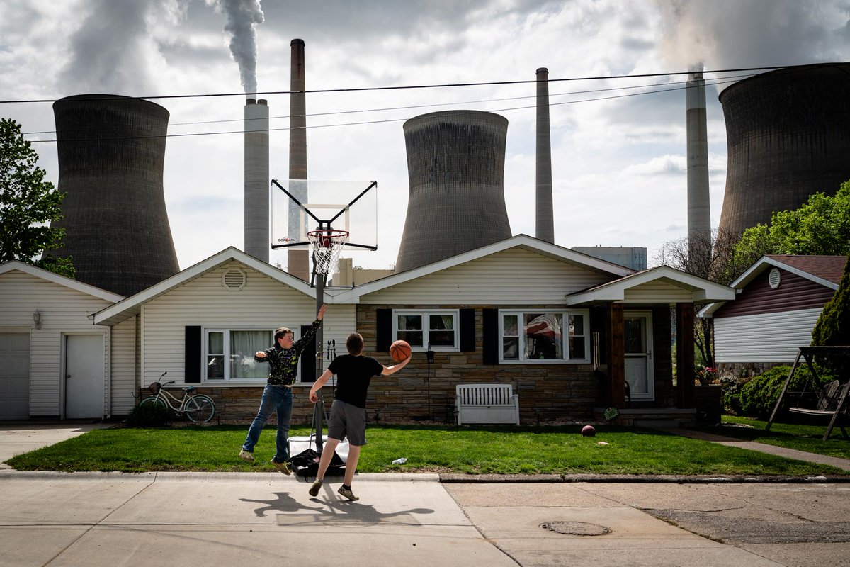 Children playing basketball near the John E. Amos coalfired power