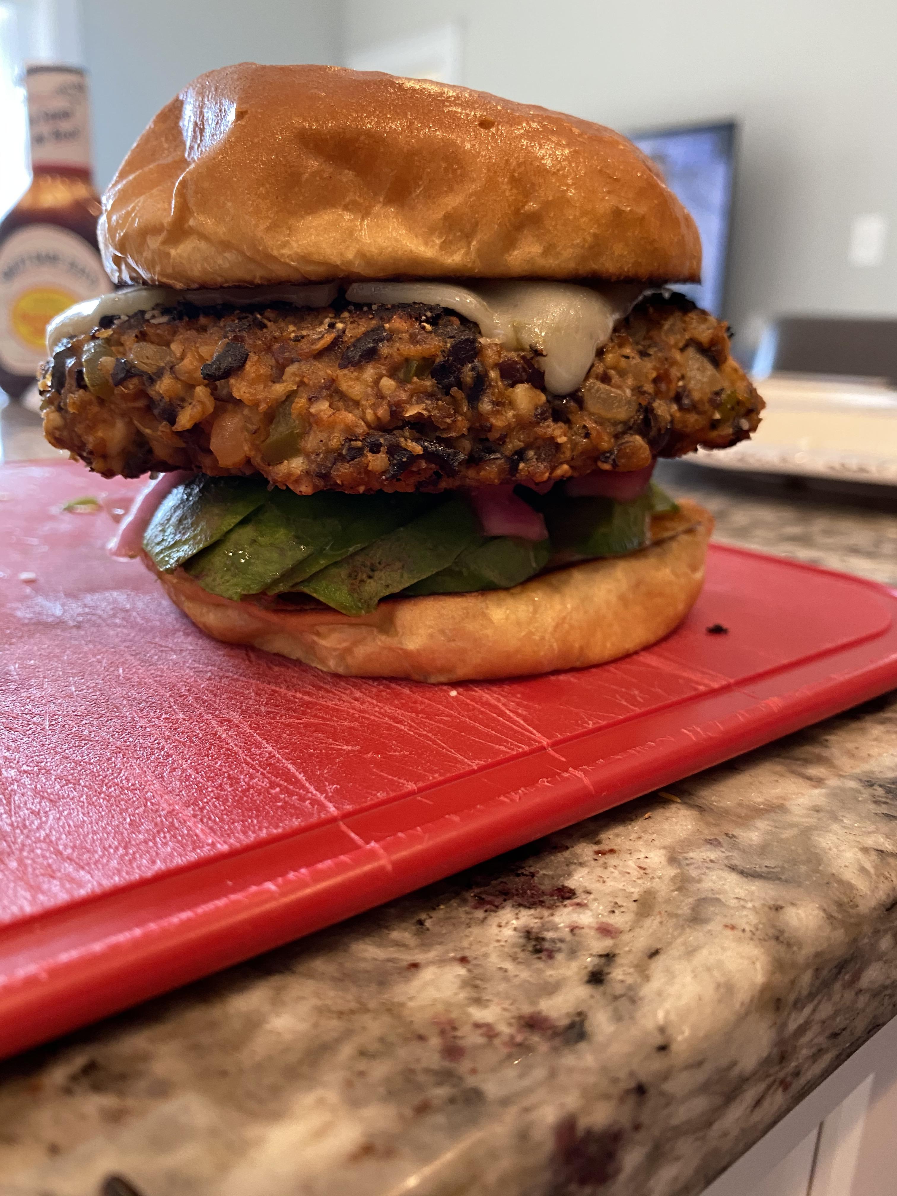 Kenji’s Black Bean Burgers on brioche with loads of avocado and homemade pickled onions. Who